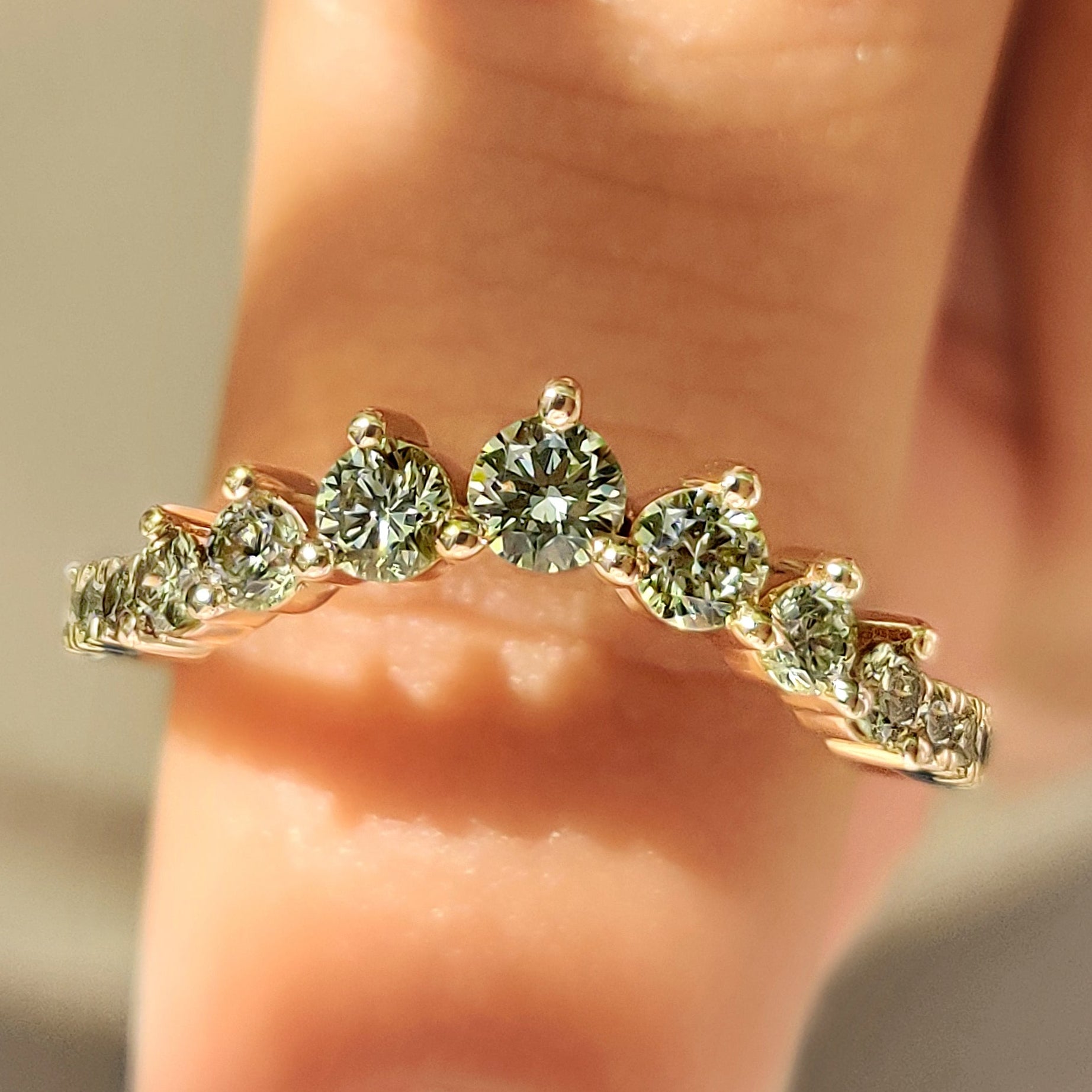 Half eternity wedding band with green round diamonds design
