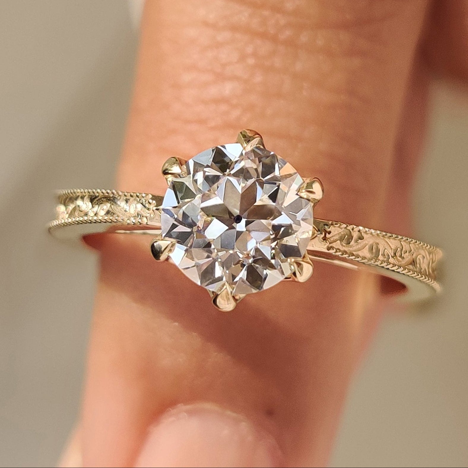 Old European cut round diamond ring in solitaire style
