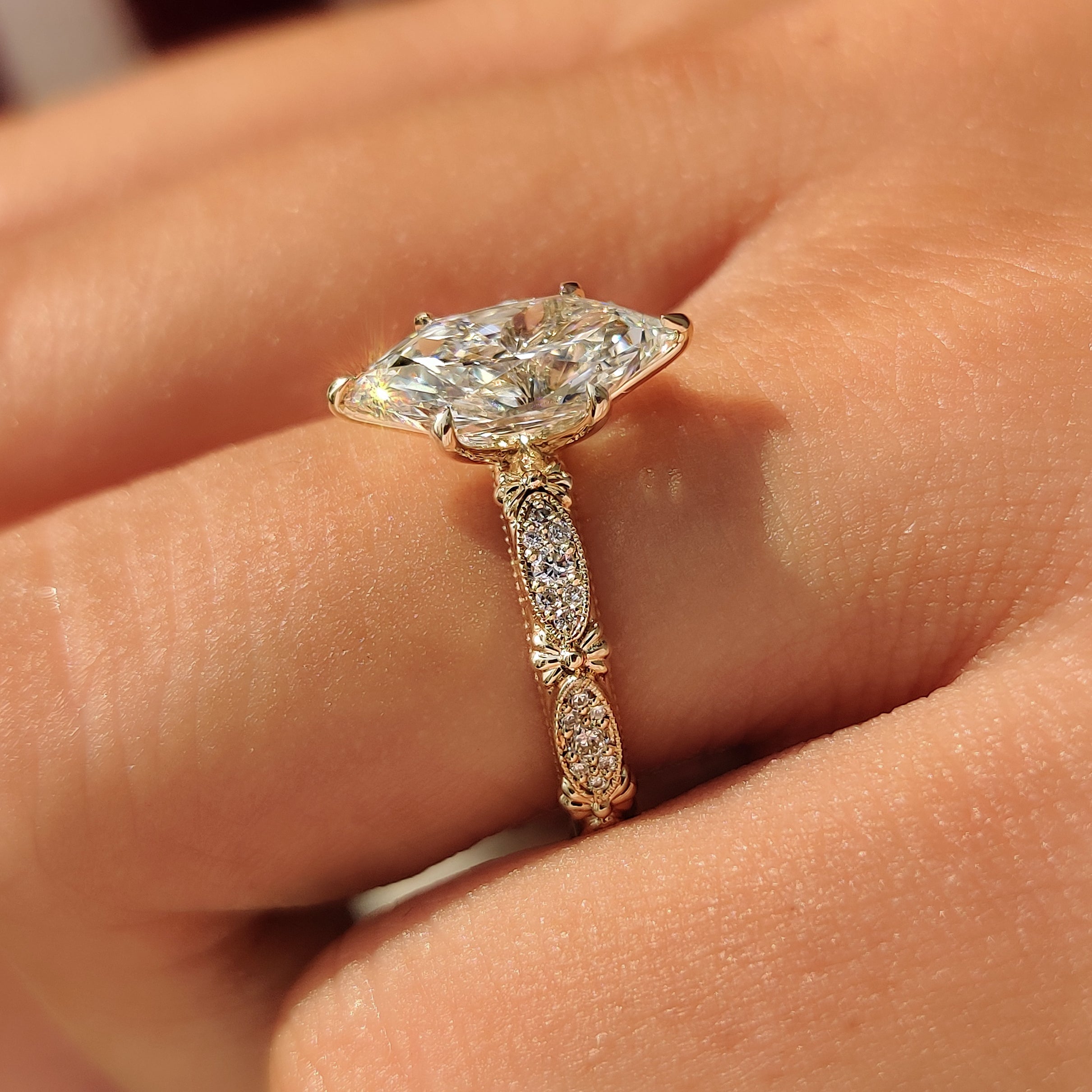 Yellow gold ring with Dutch marquise and round diamonds.
