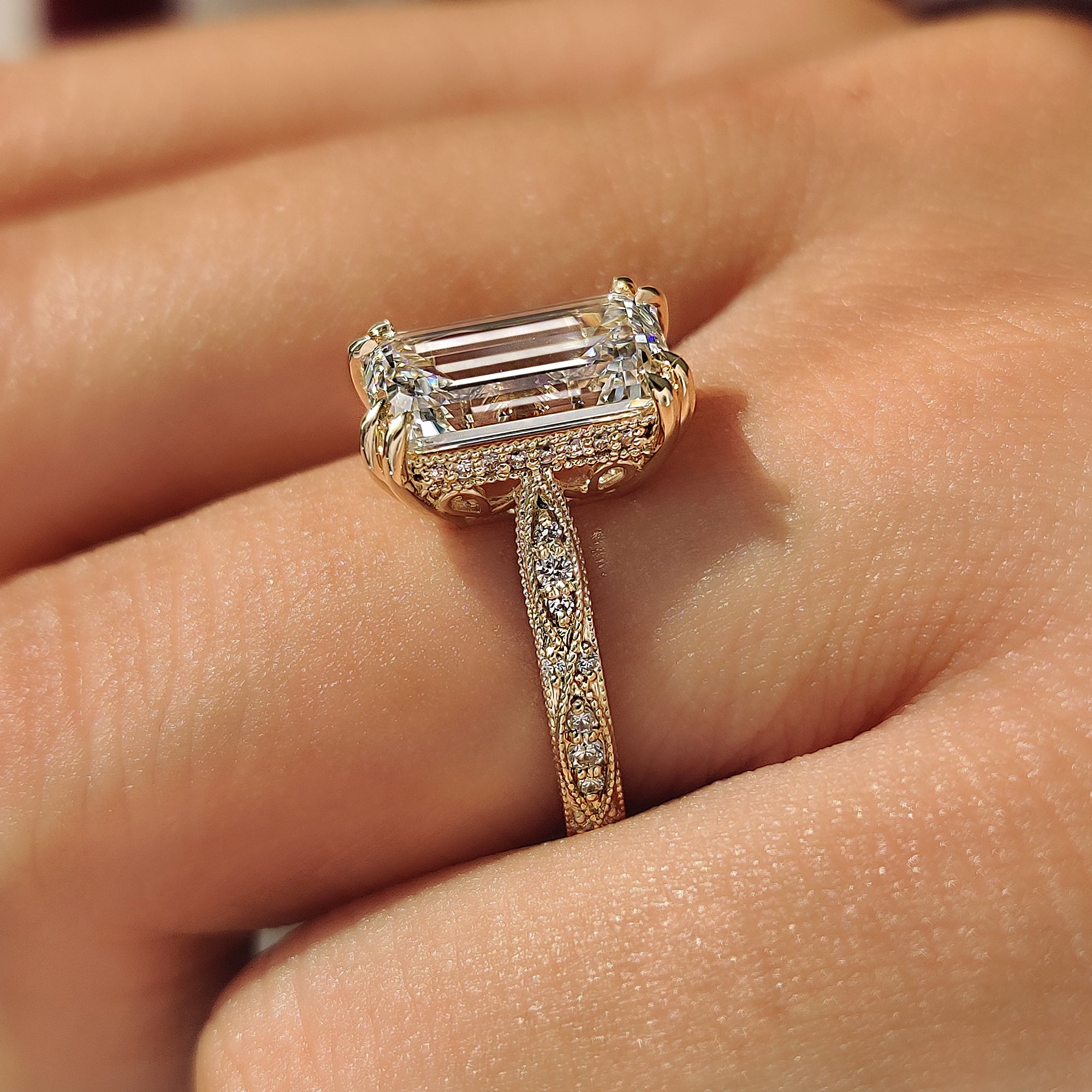 Handmade emerald cut diamond ring in yellow gold.
