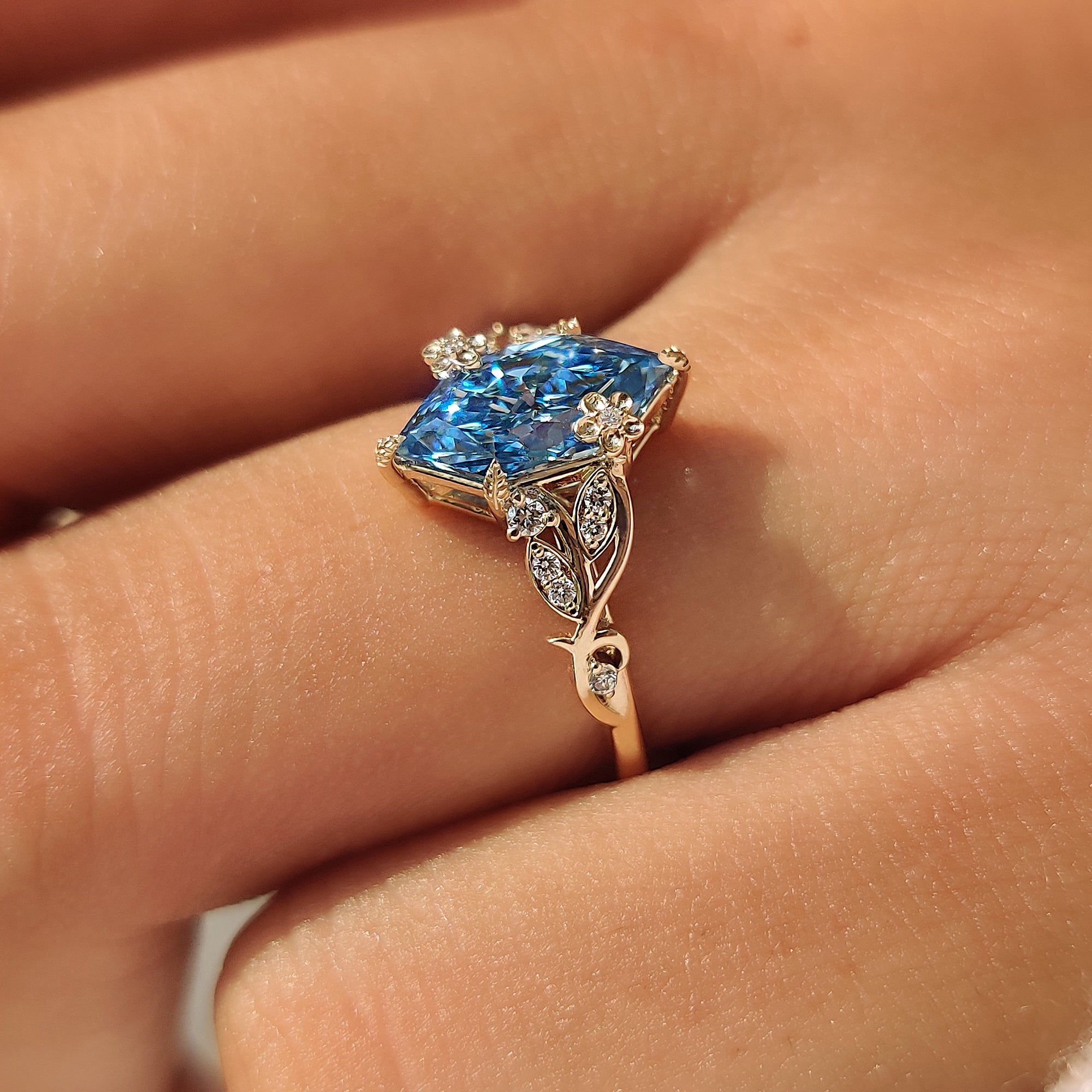 Blue Dutch marquise diamond held by leaf style prongs.
