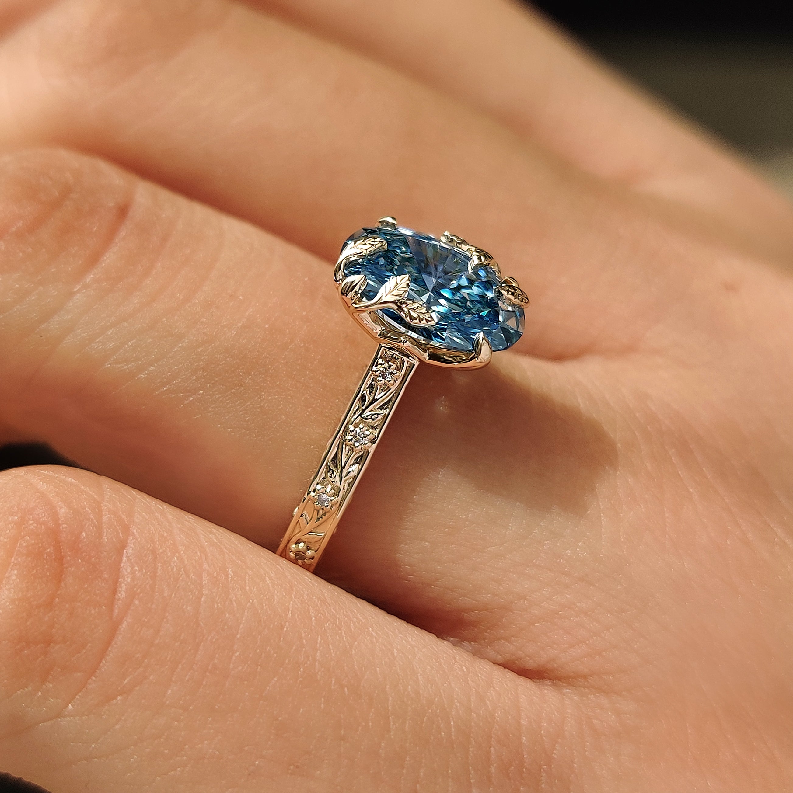 Nature inspired blue oval diamond ring
