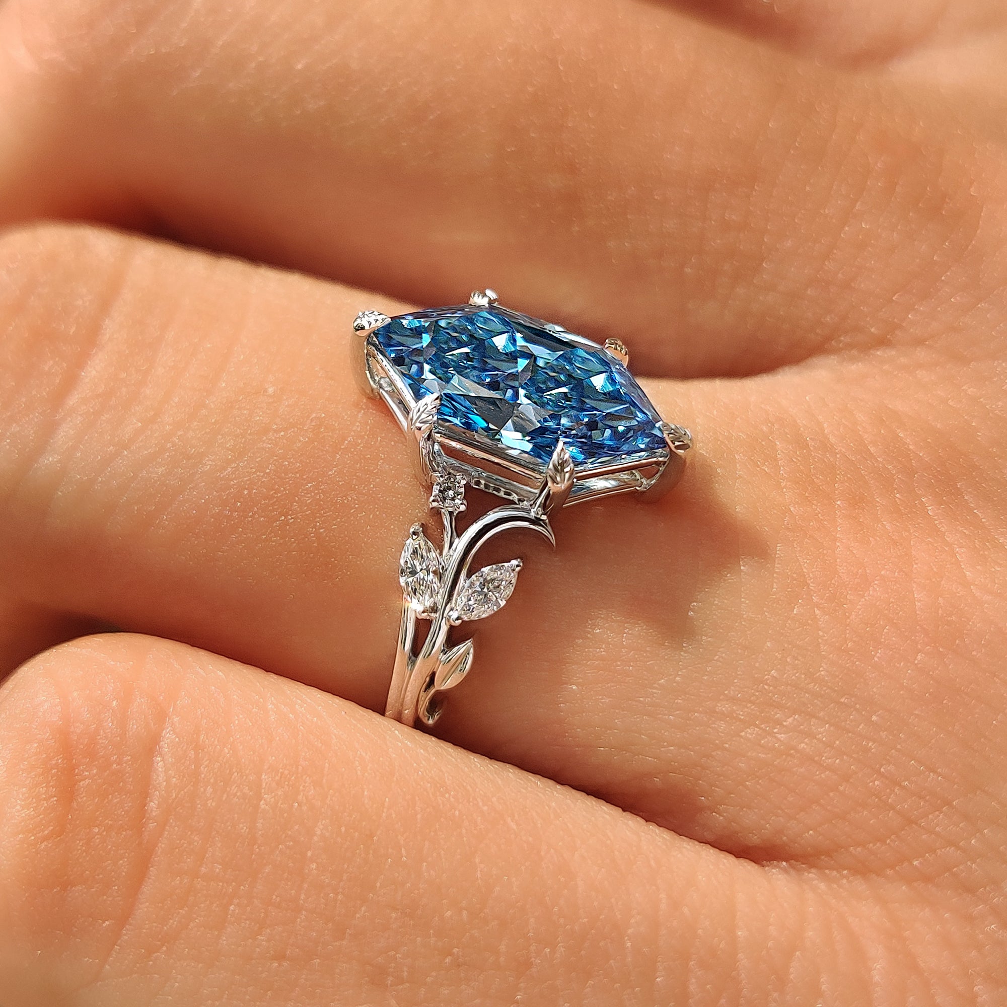 White gold engagement ring with nature inspired style.
