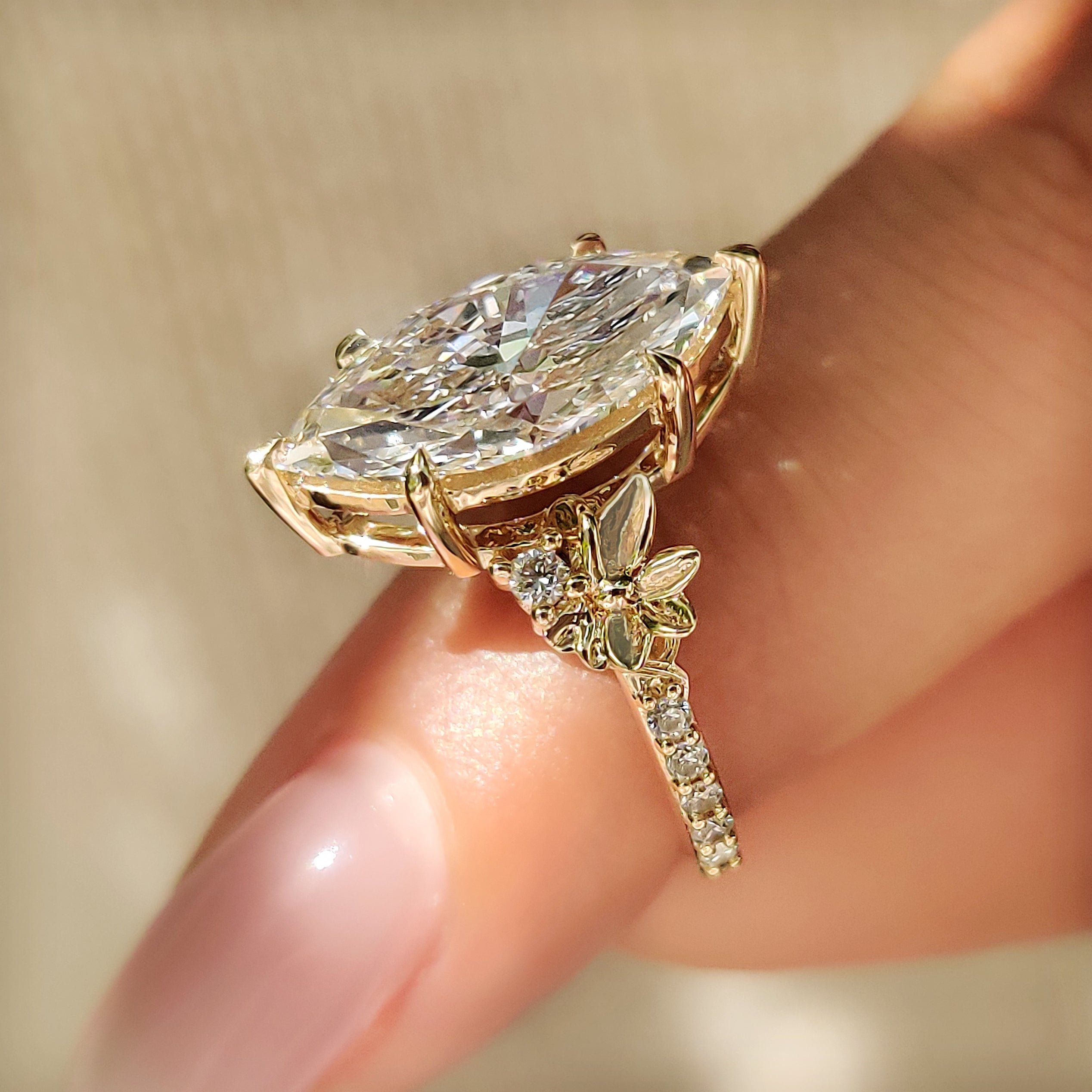Art deco marquise diamond ring with round pave diamonds

