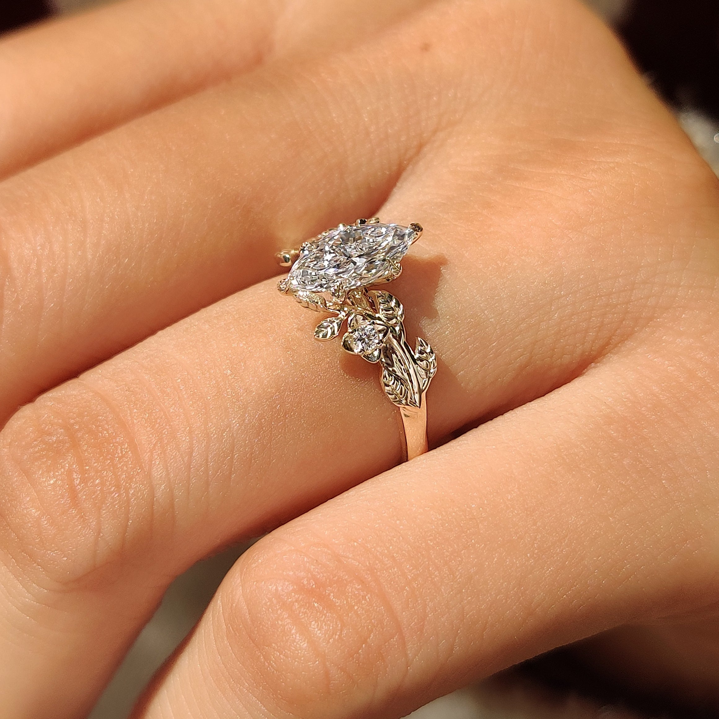 Handmade marquise engagement ring with floral cluster setting
