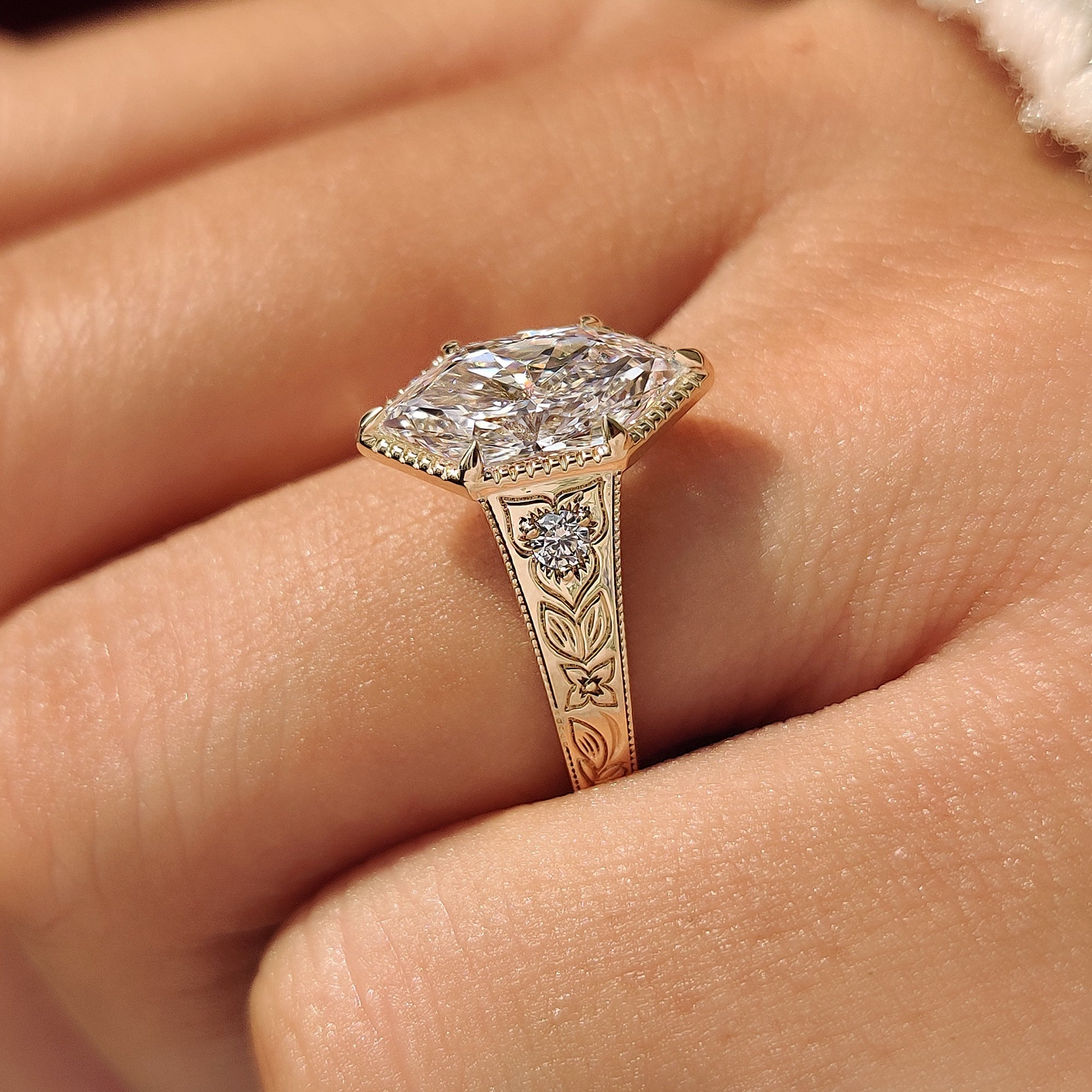 Vintage Dutch marquise ring with hand engraved leaf and floral shank.
