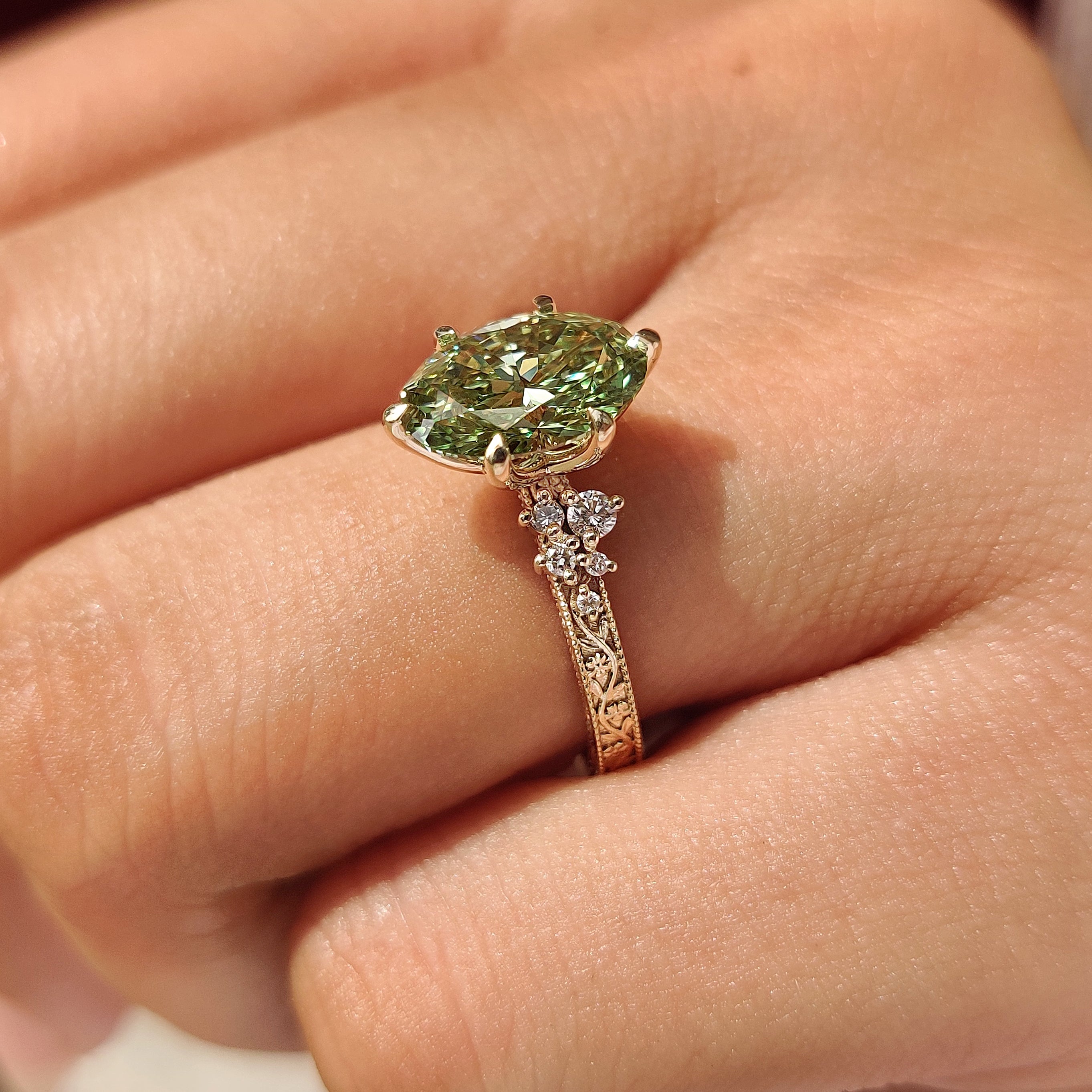 Tulip setting green oval engagement ring
