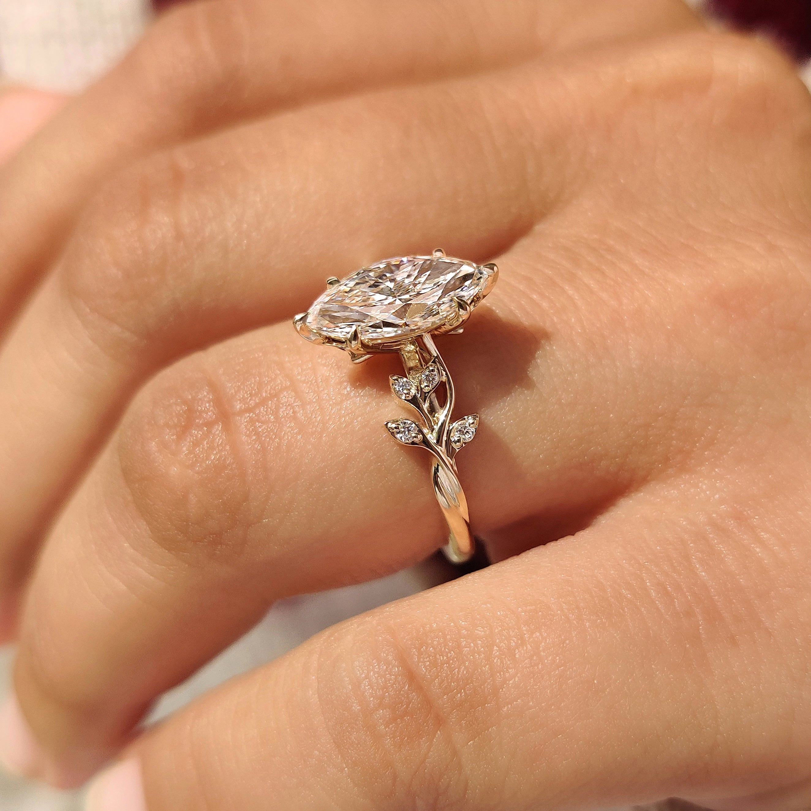 Marquise ring with hidden diamond leaf detail.
