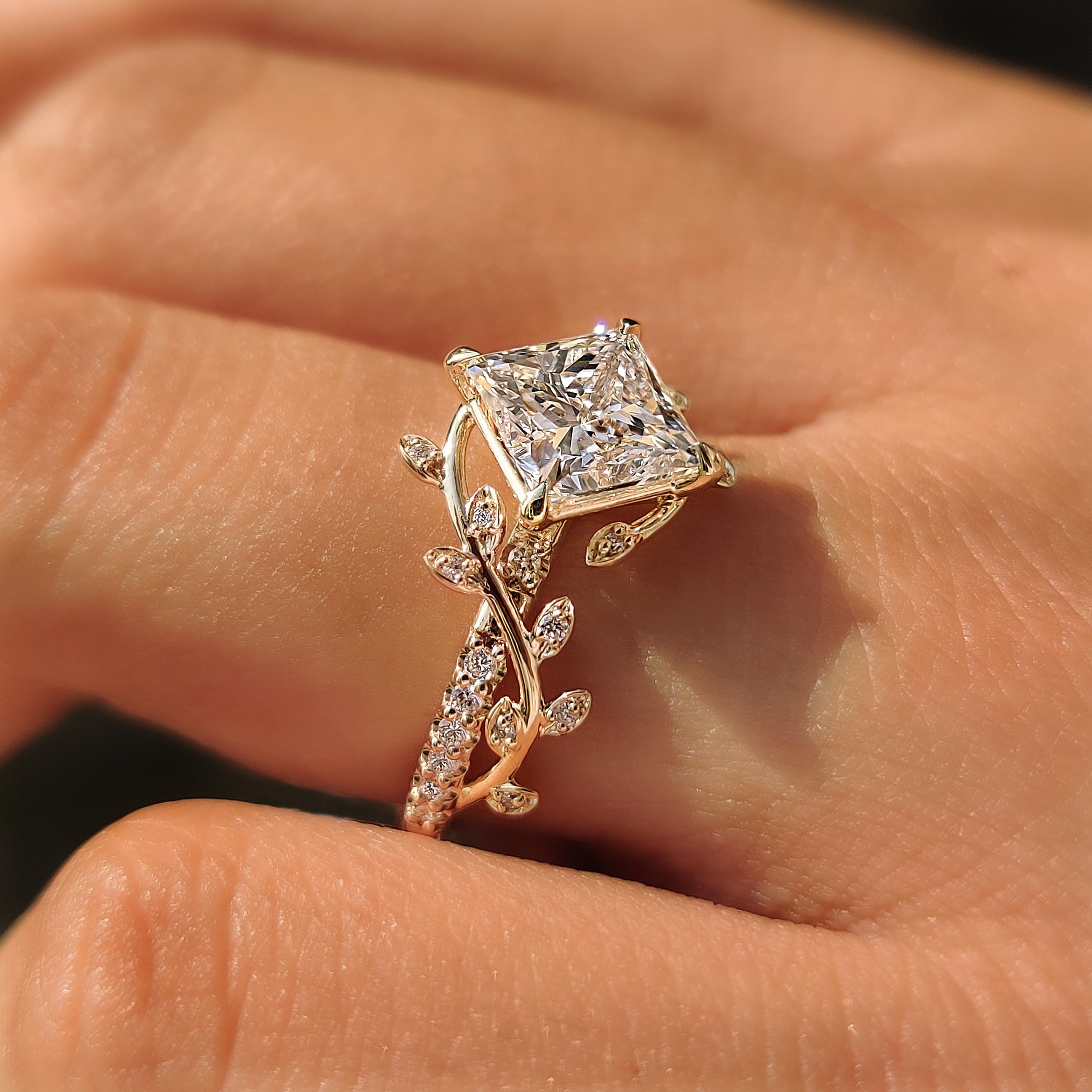 Yellow gold bypass ring with round diamond accents.
