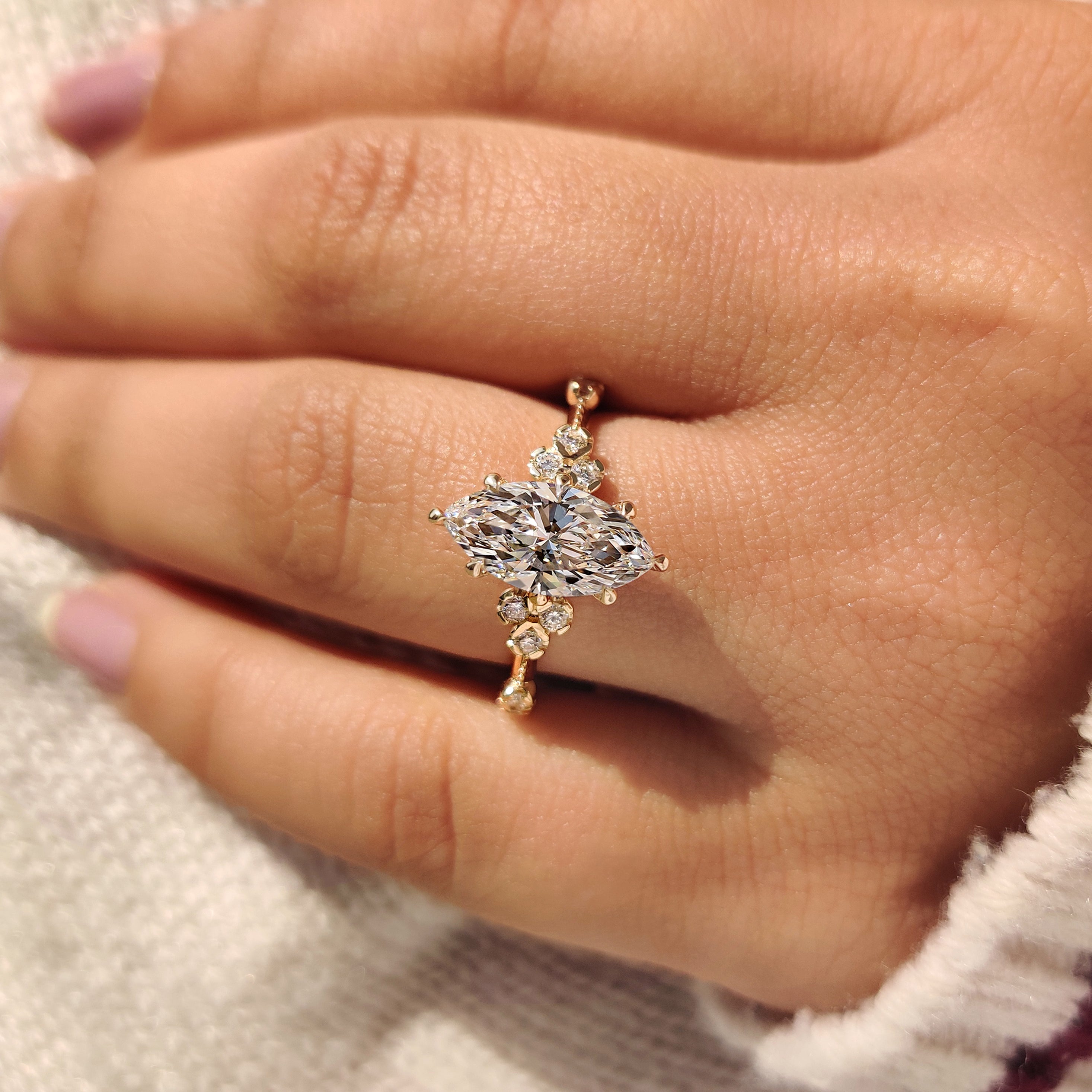 Marquise diamond ring in muse setting with knife edge shank.
