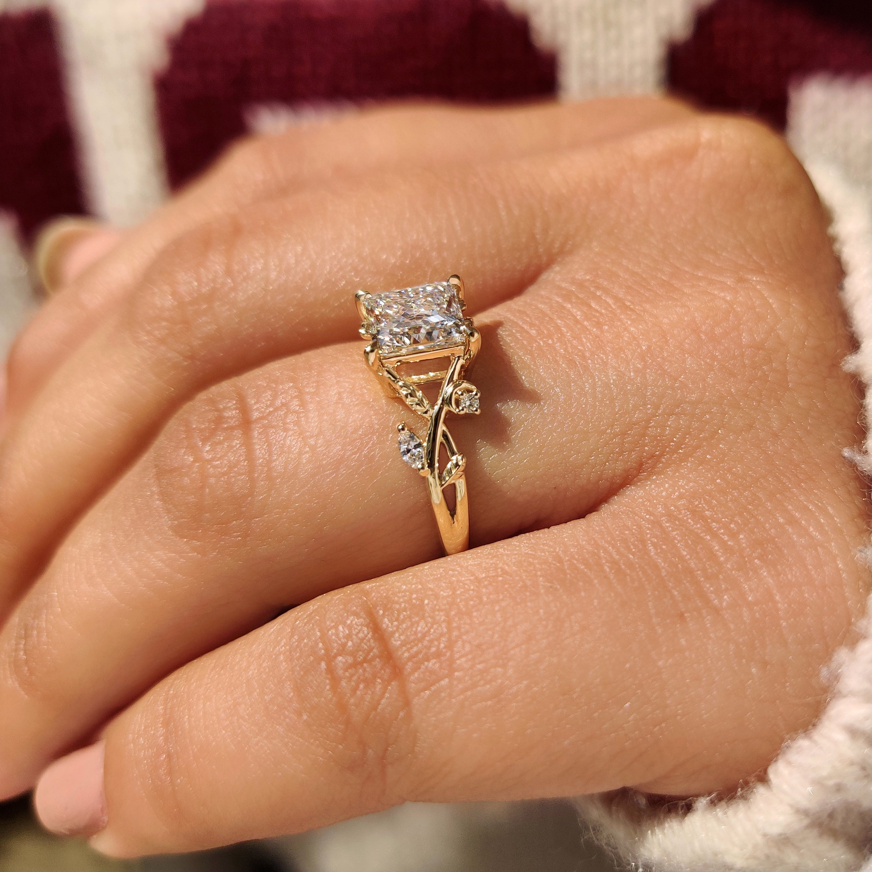 Princess cut ring with marquise and round side stones.
