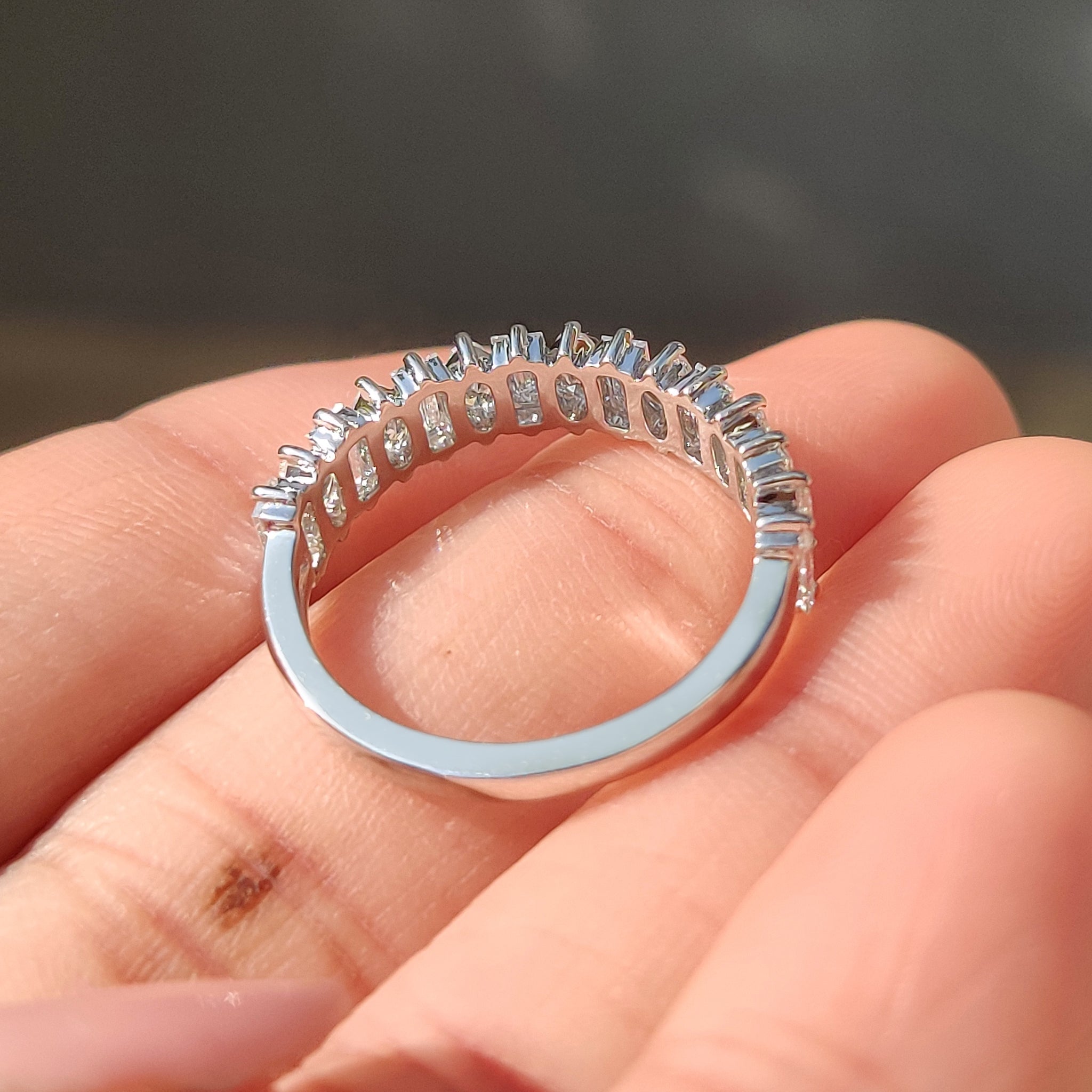 Handmade wedding band with half eternity diamond layout
