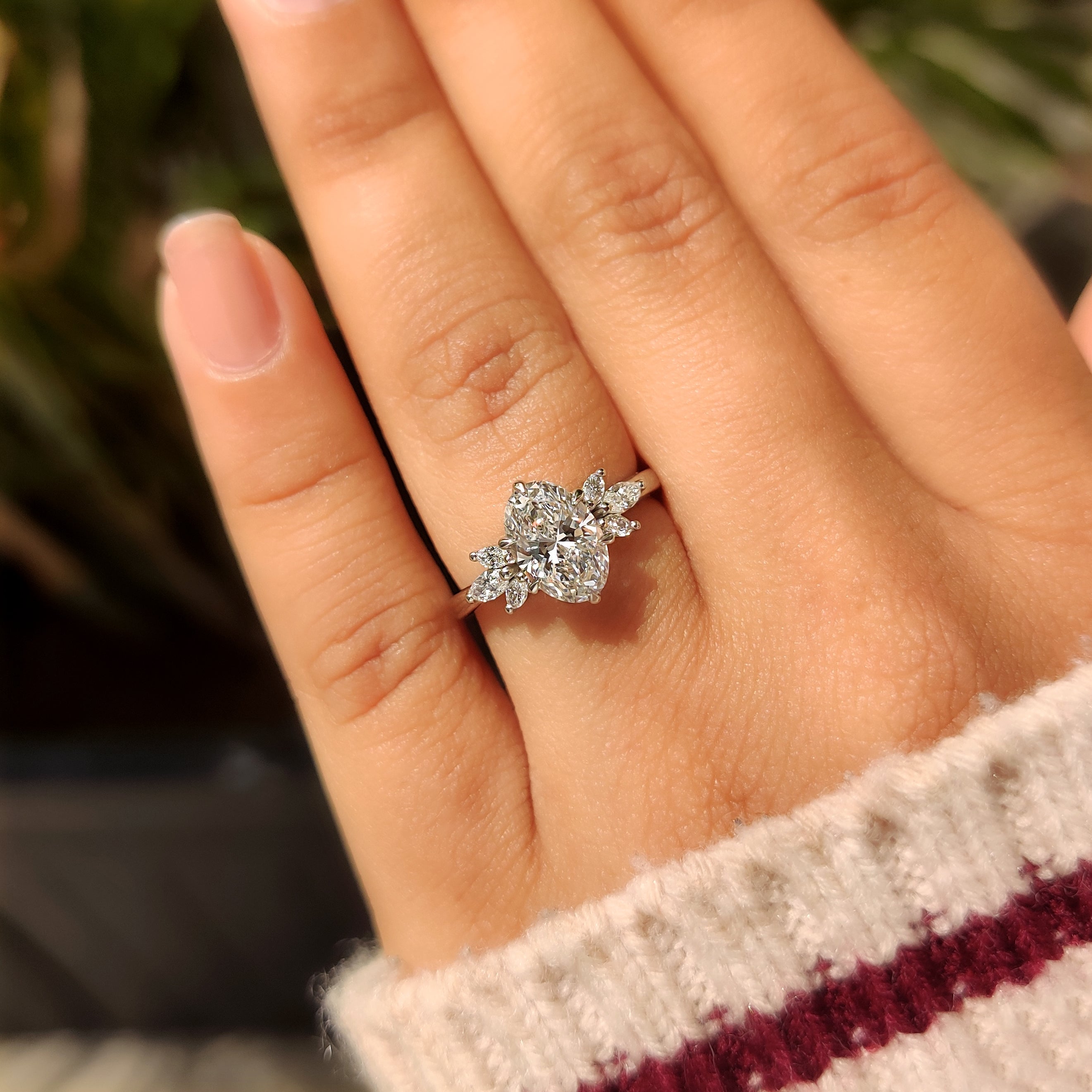 Oval cut diamond ring with tulip and muse settings
