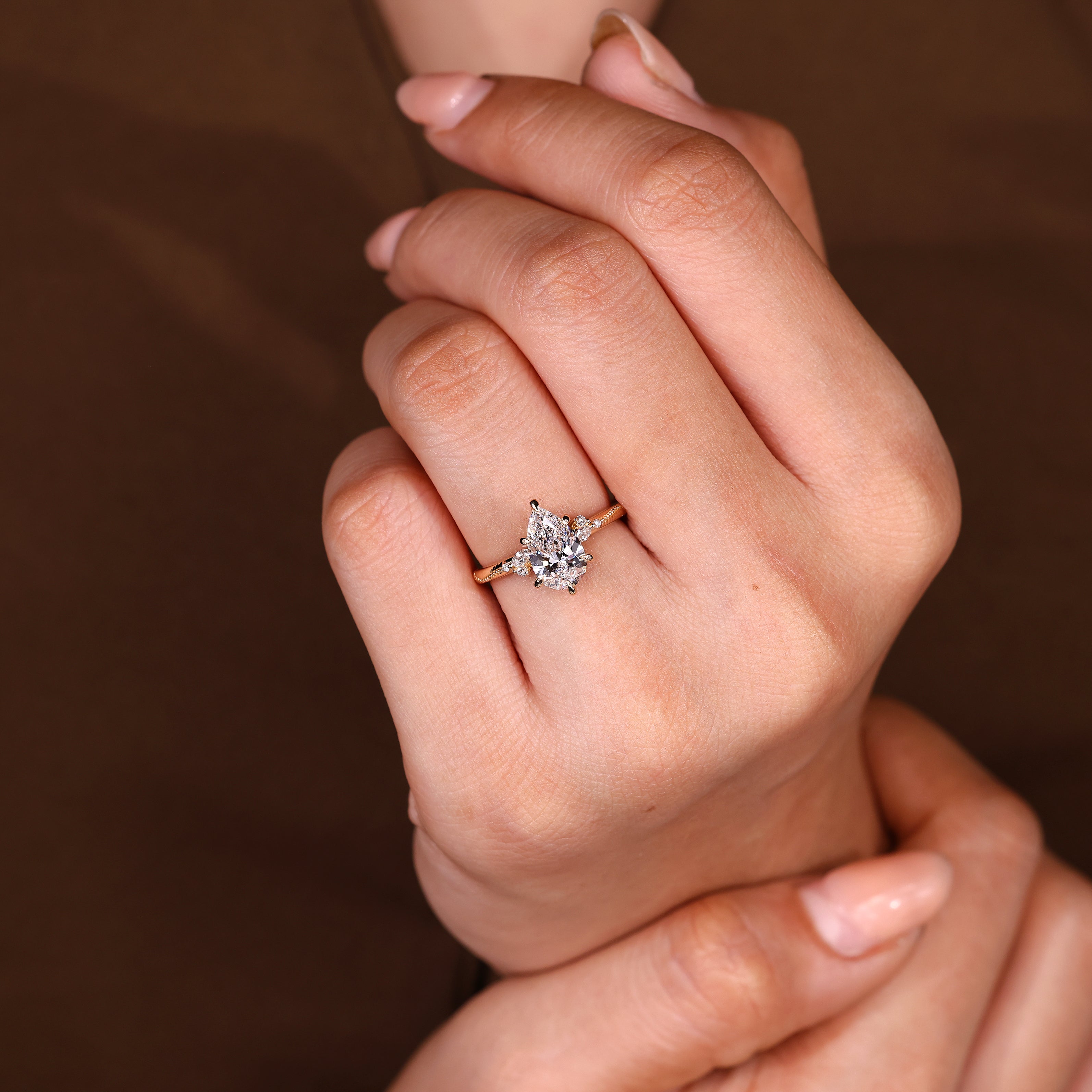 Handmade pear diamond ring with milgrain edge details

