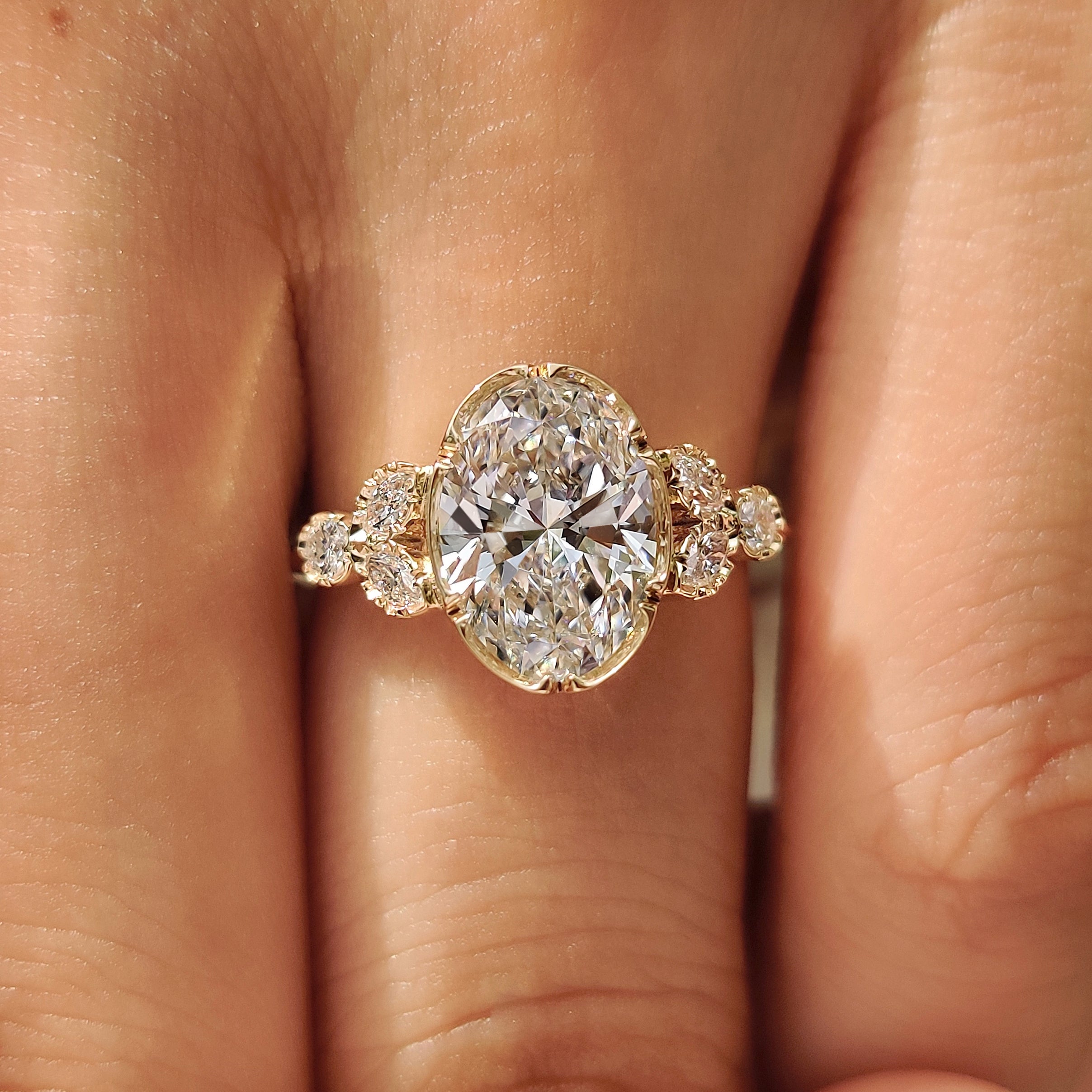 Oval center diamond with marquise side stones

