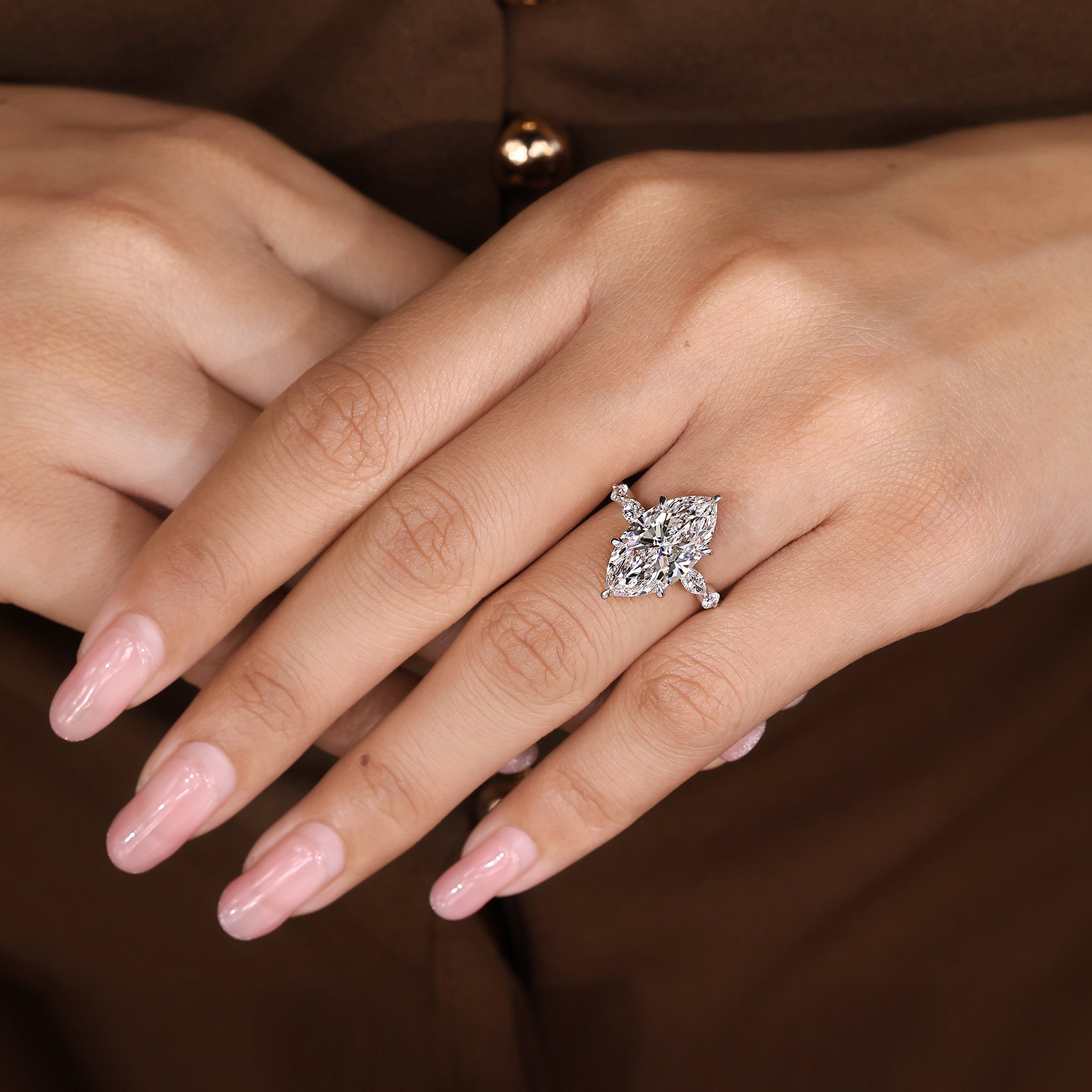 Lab grown marquise diamond ring with marquise and round accents
