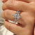 Marquise cut engagement ring with round side diamonds.
