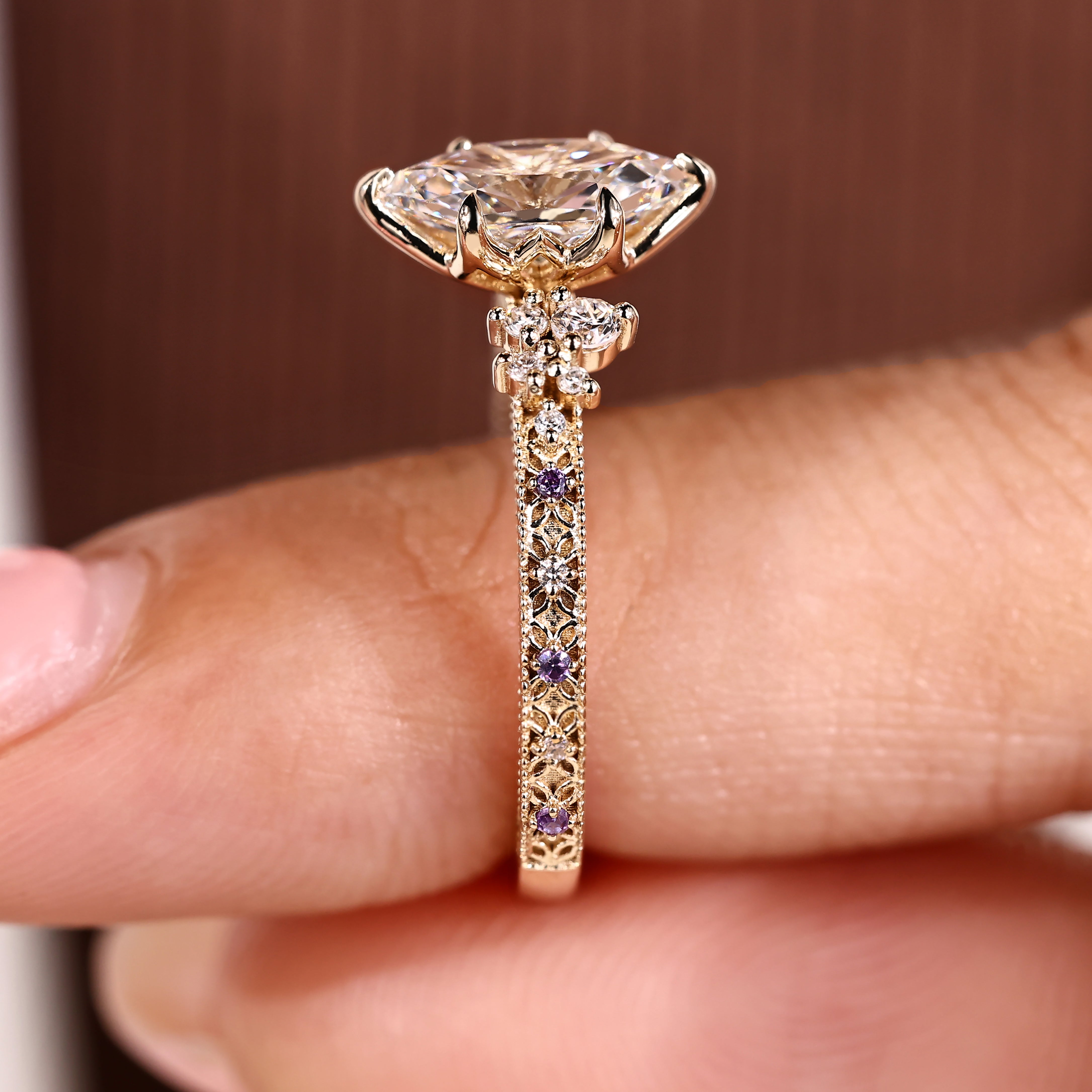 Round side stones paired with dutch marquise center diamond
