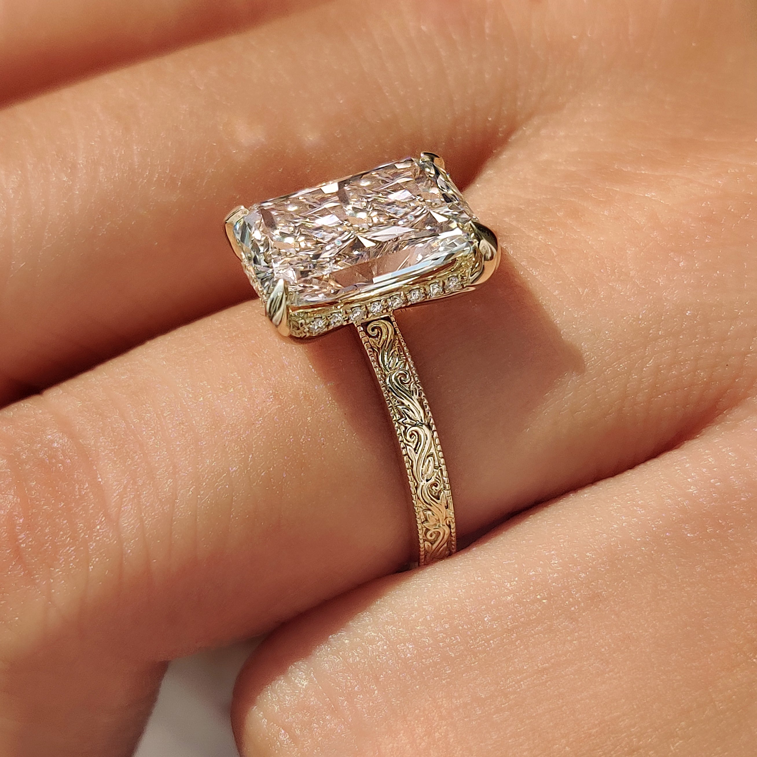 Radiant engagement ring with vintage inspired filigree.
