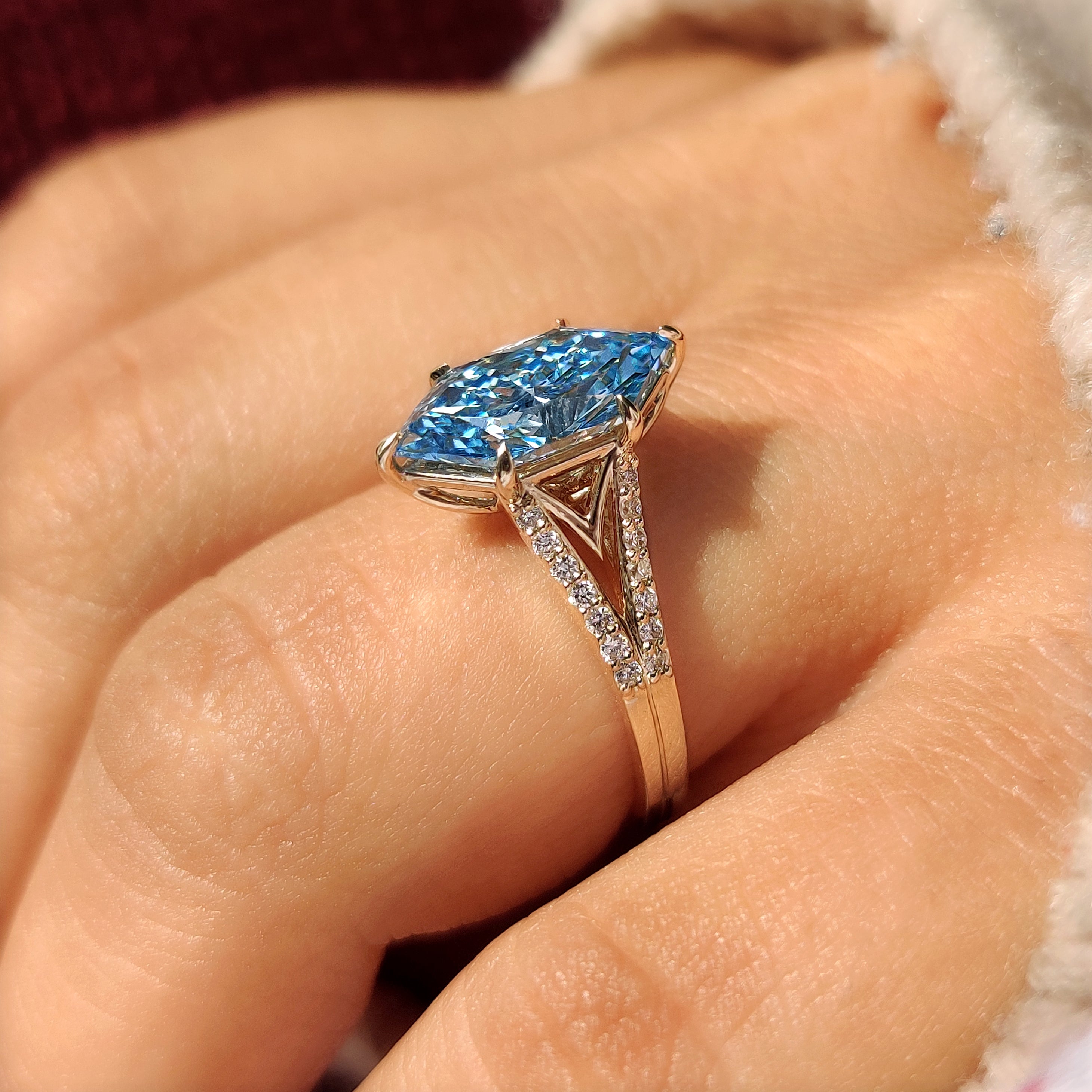 Blue center Dutch marquise diamond ring with split shank
