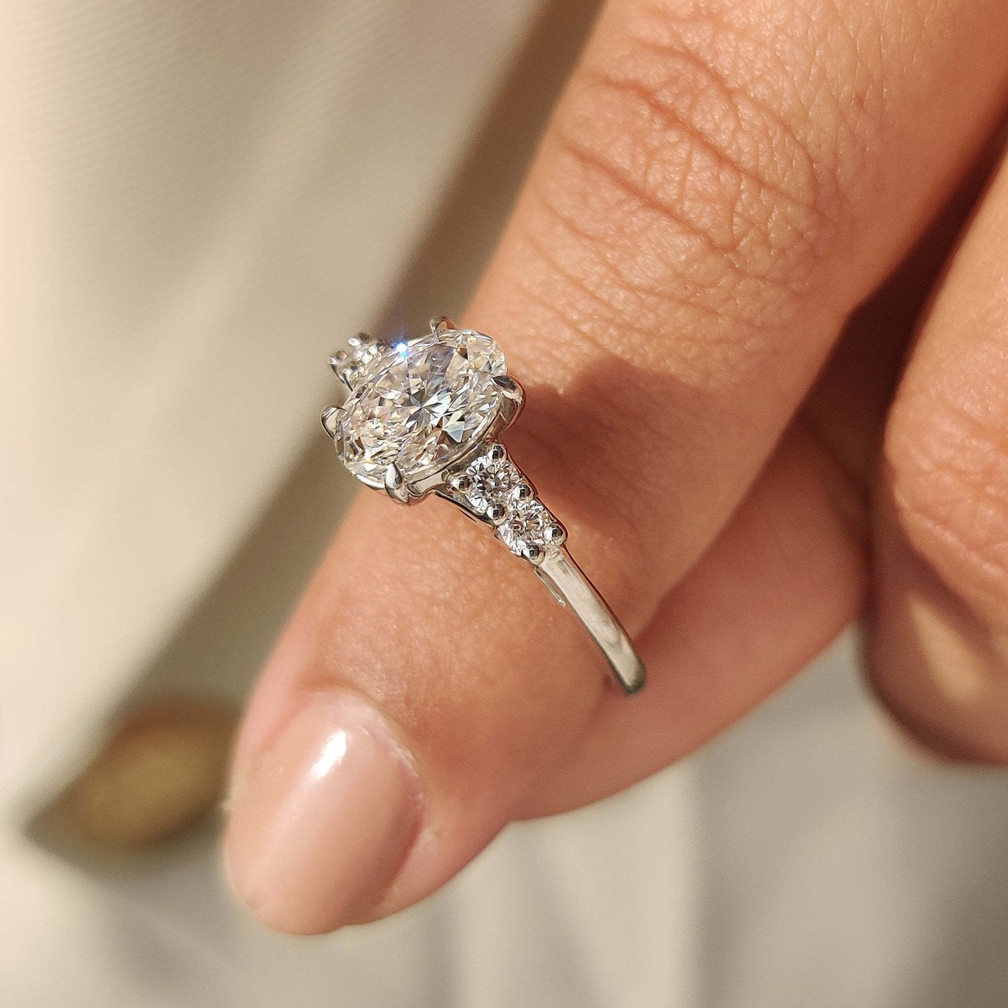 Handmade oval cut diamond ring with claw prongs.
