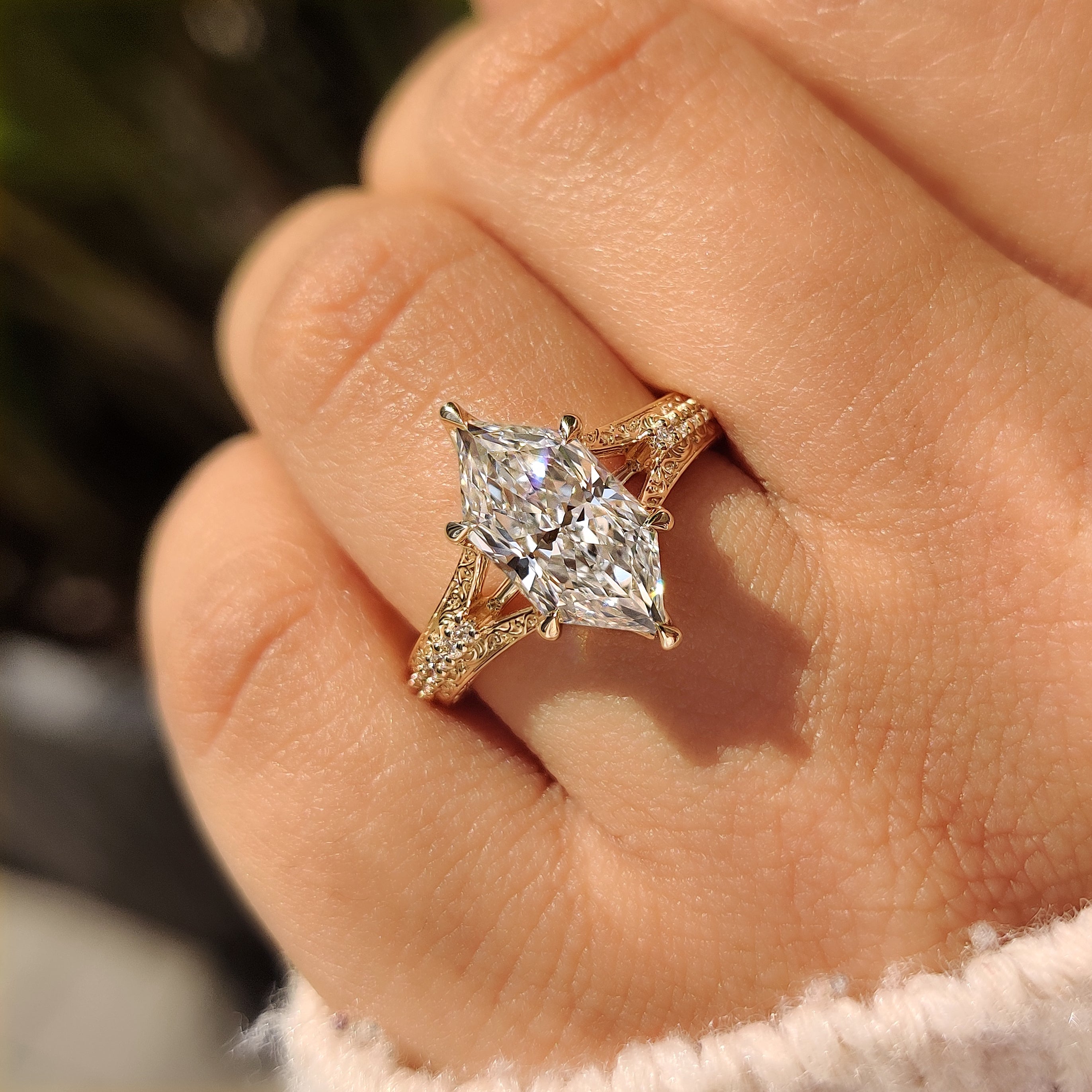 Split shank marquise diamond ring with tulip setting style
