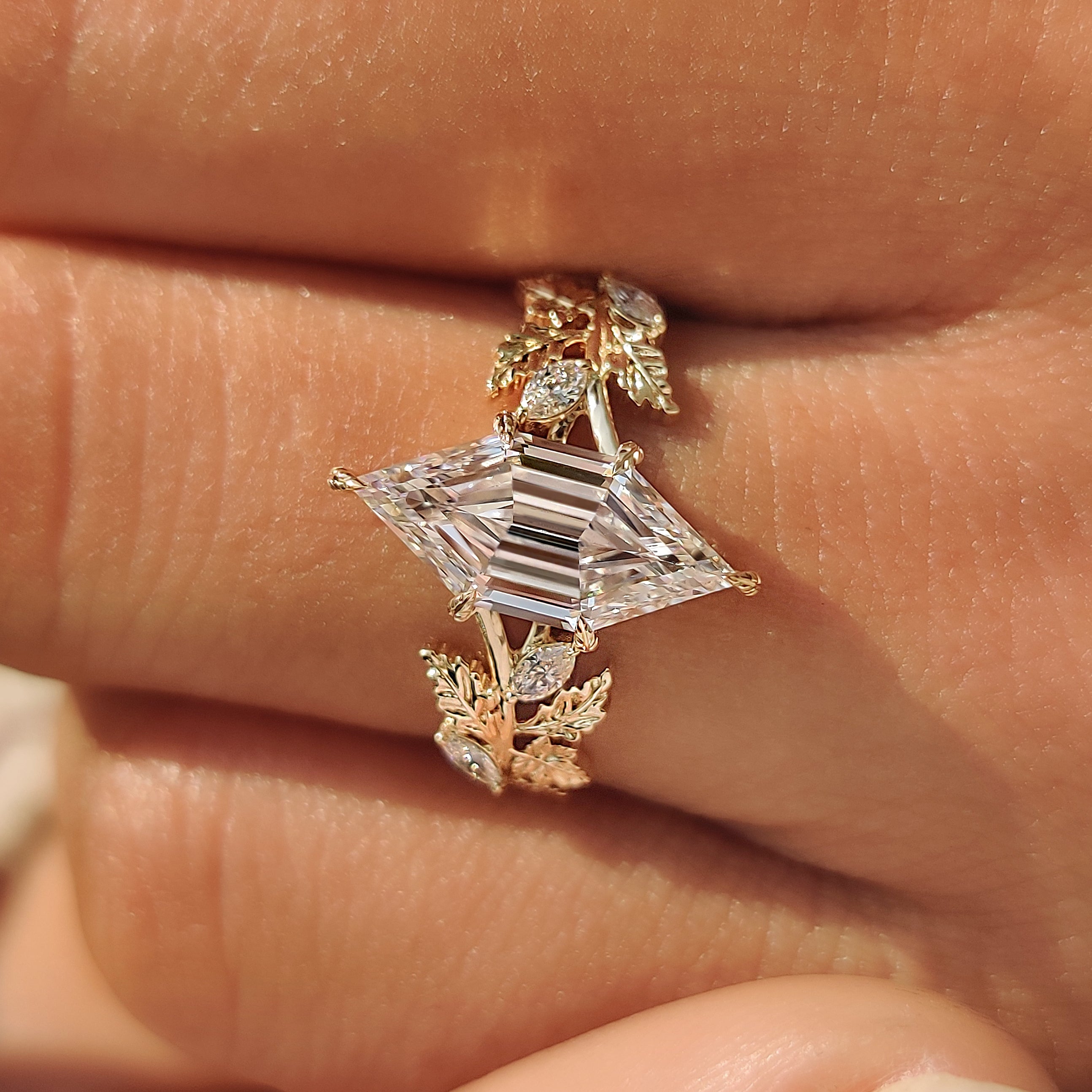 Nature inspired engagement ring with a autumn leaf and vine band.

