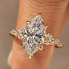Marquise diamond ring with marquise side stone and muse setting
