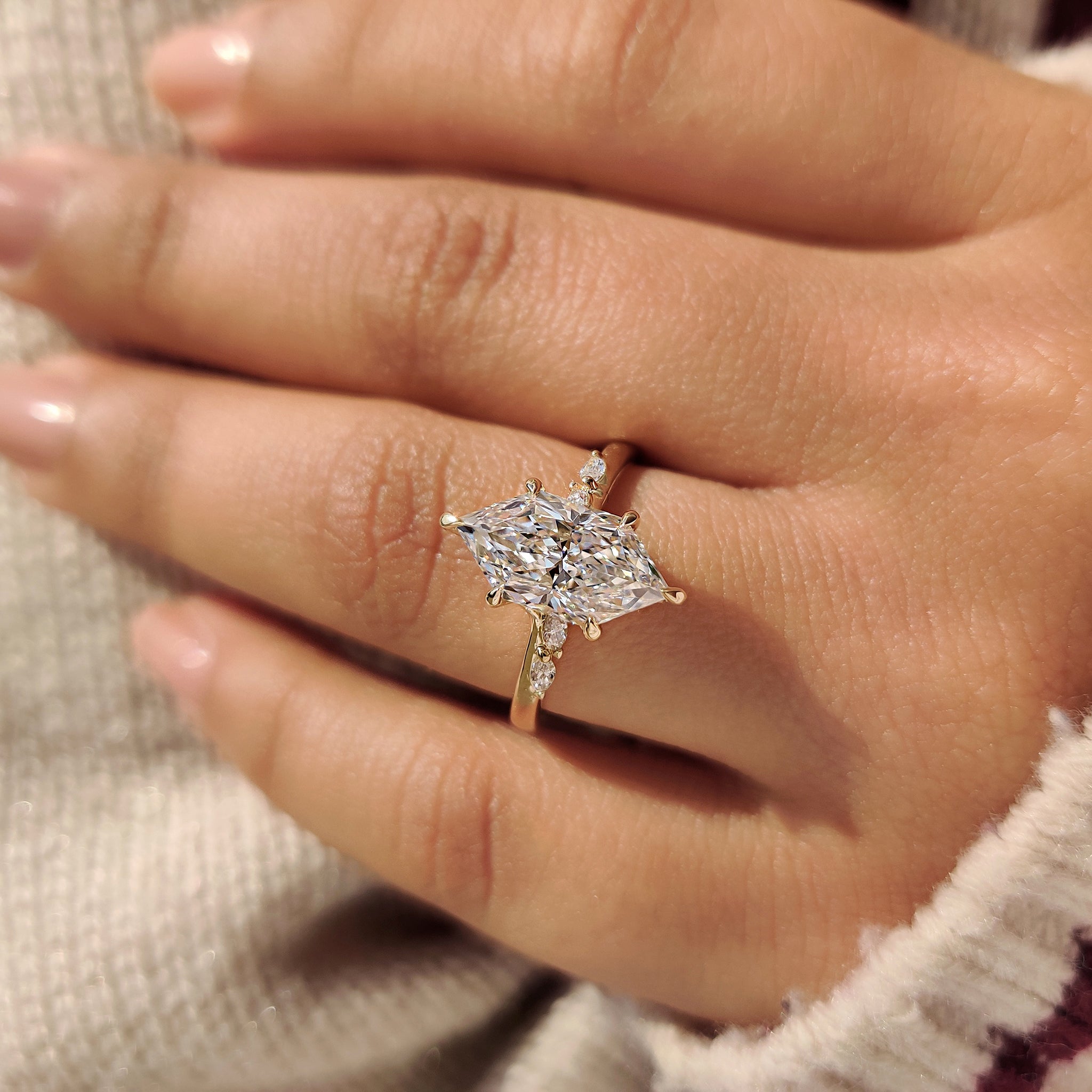 Dutch marquise ring with round cut bridge accent.
