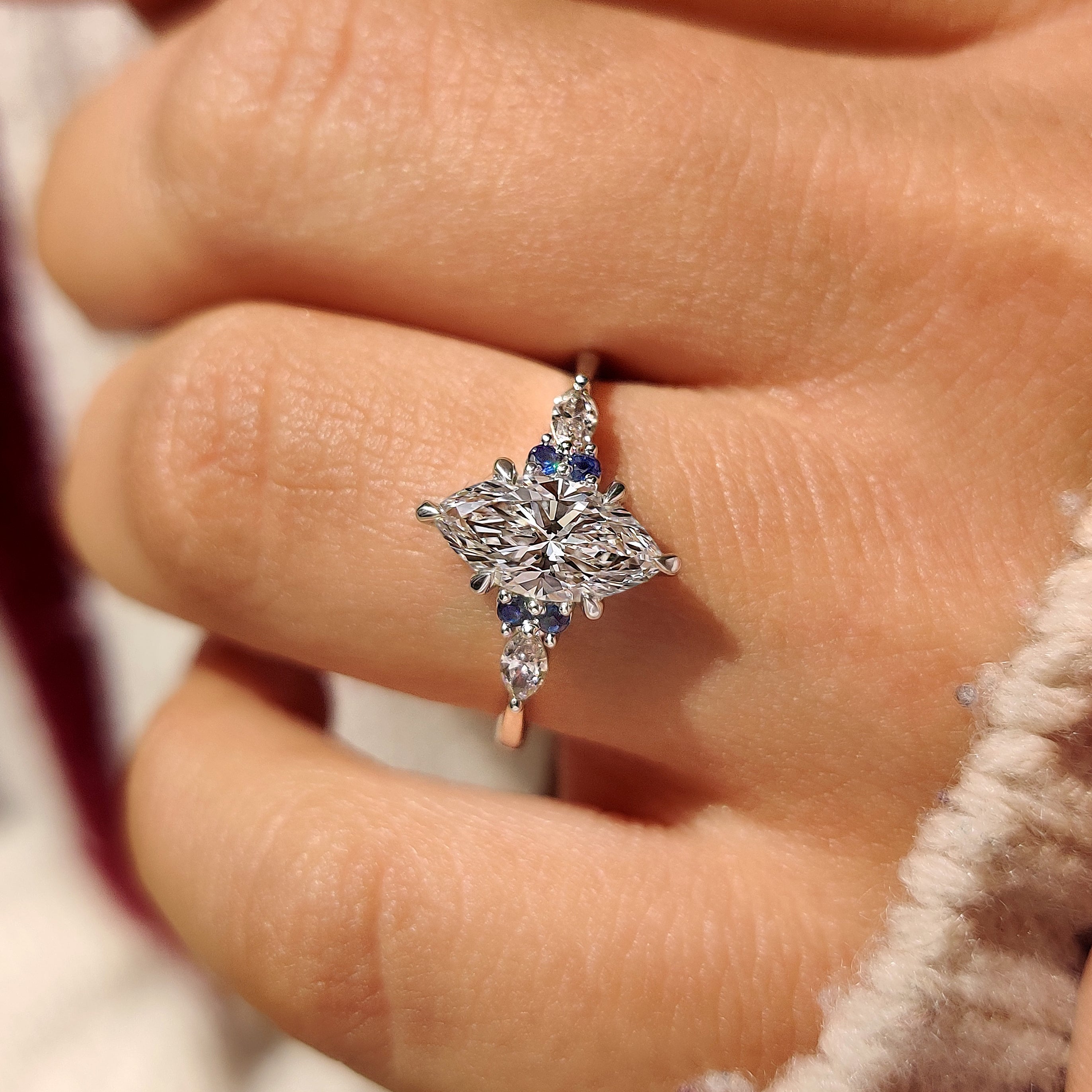 Handmade marquise engagement ring with seven stone style

