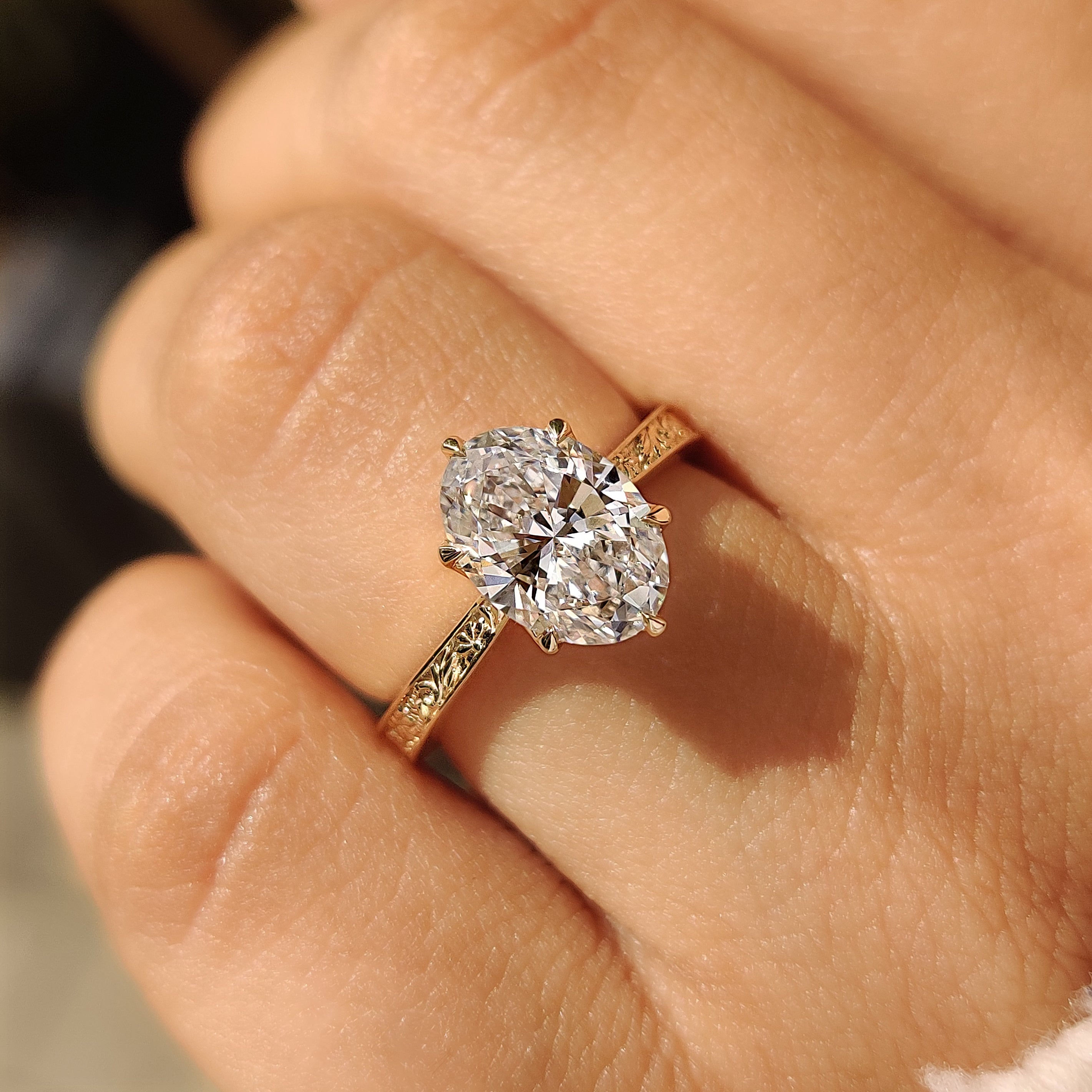 Tulip setting oval diamond ring with six claw prongs

