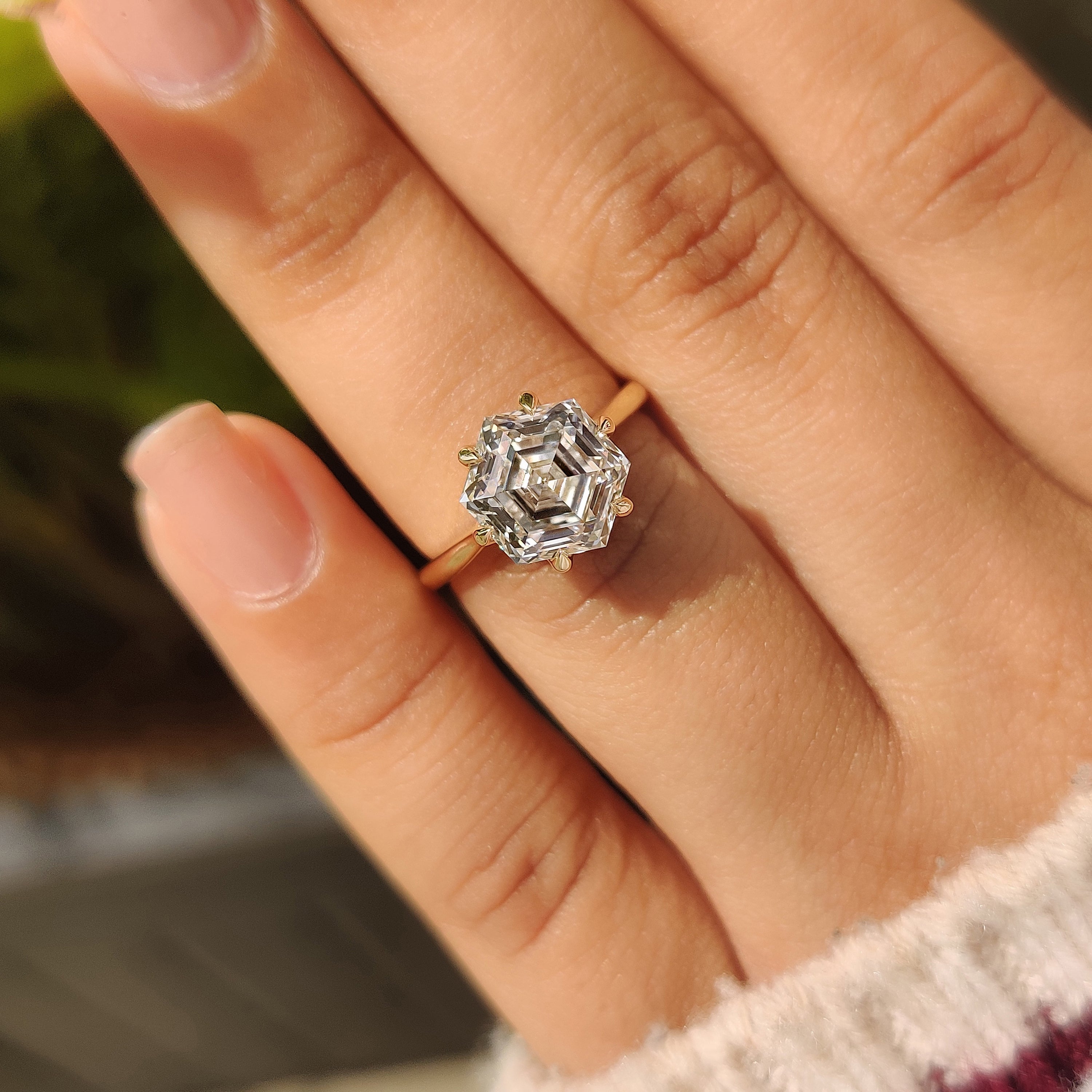 Hexagon cut diamond ring with tapered shank and prongs
