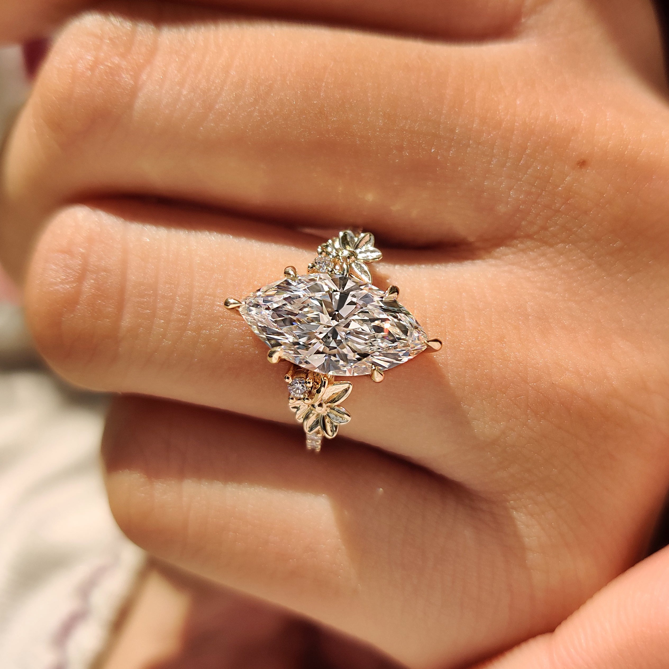 Vintage marquise diamond ring with pave round side diamonds
