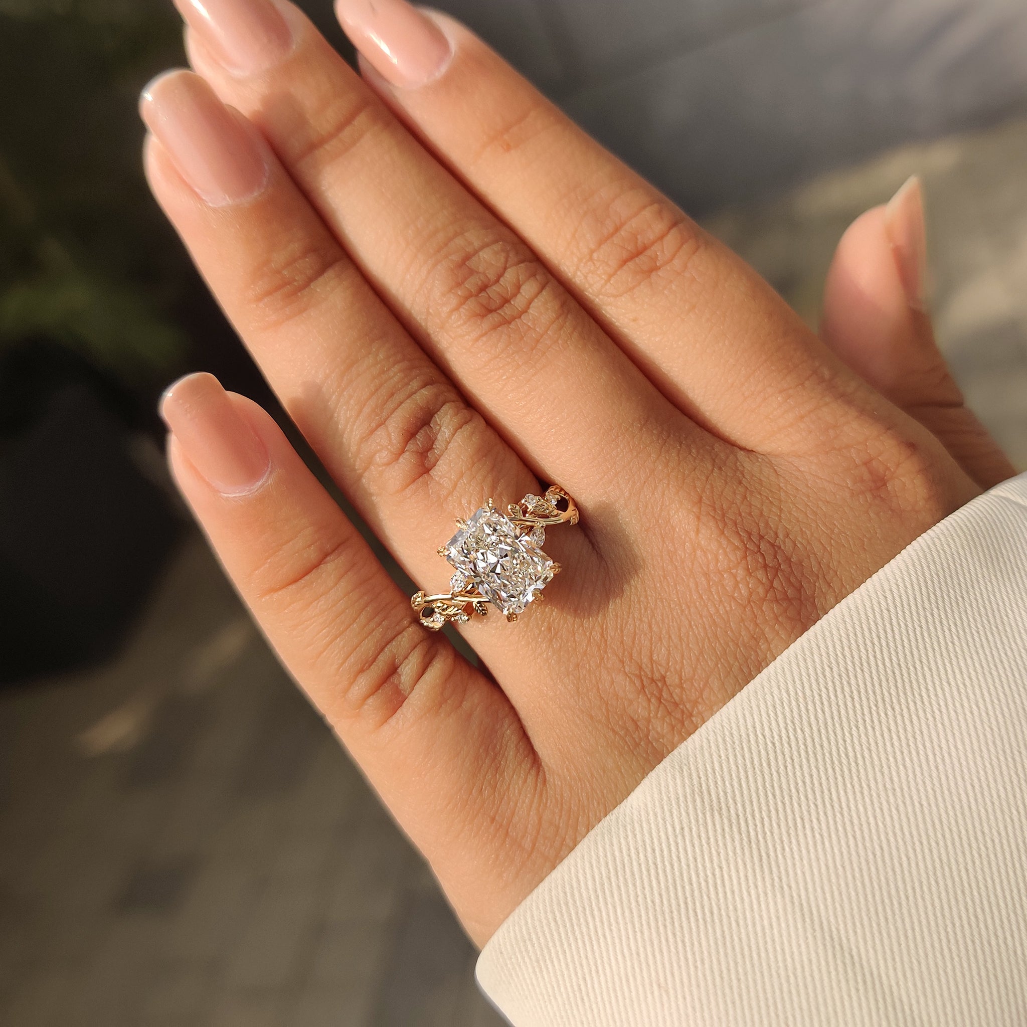 Nature inspired engagement ring with soft leaf prong design
