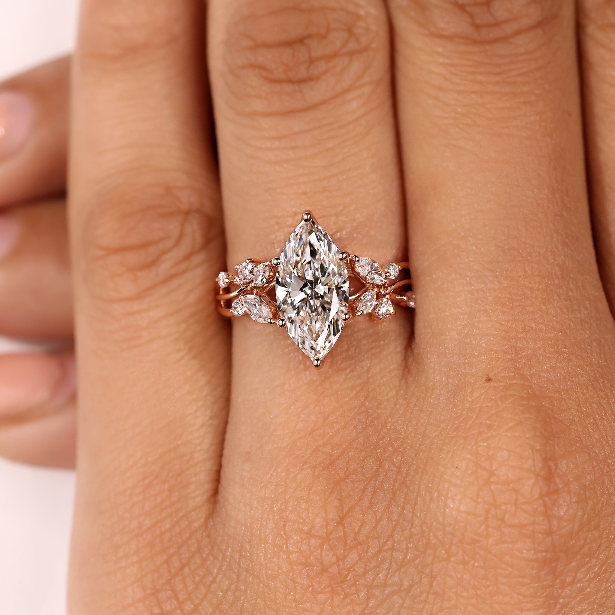 Nature inspired marquise diamond ring with detailed setting
