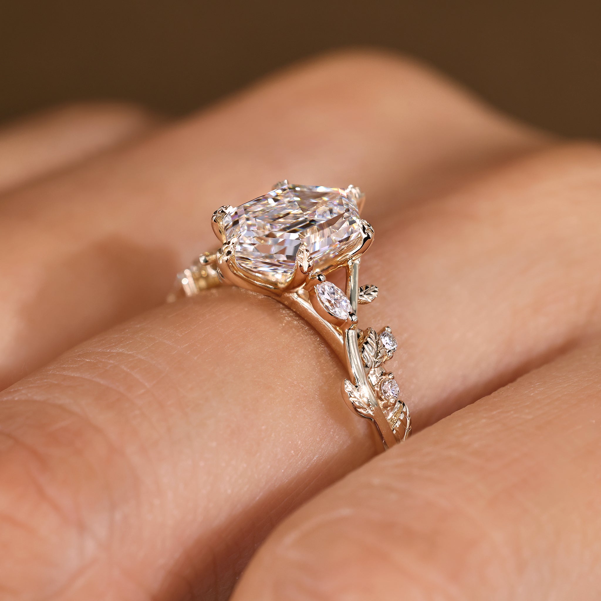 Nature inspired ring with marquise and round side stone detail
