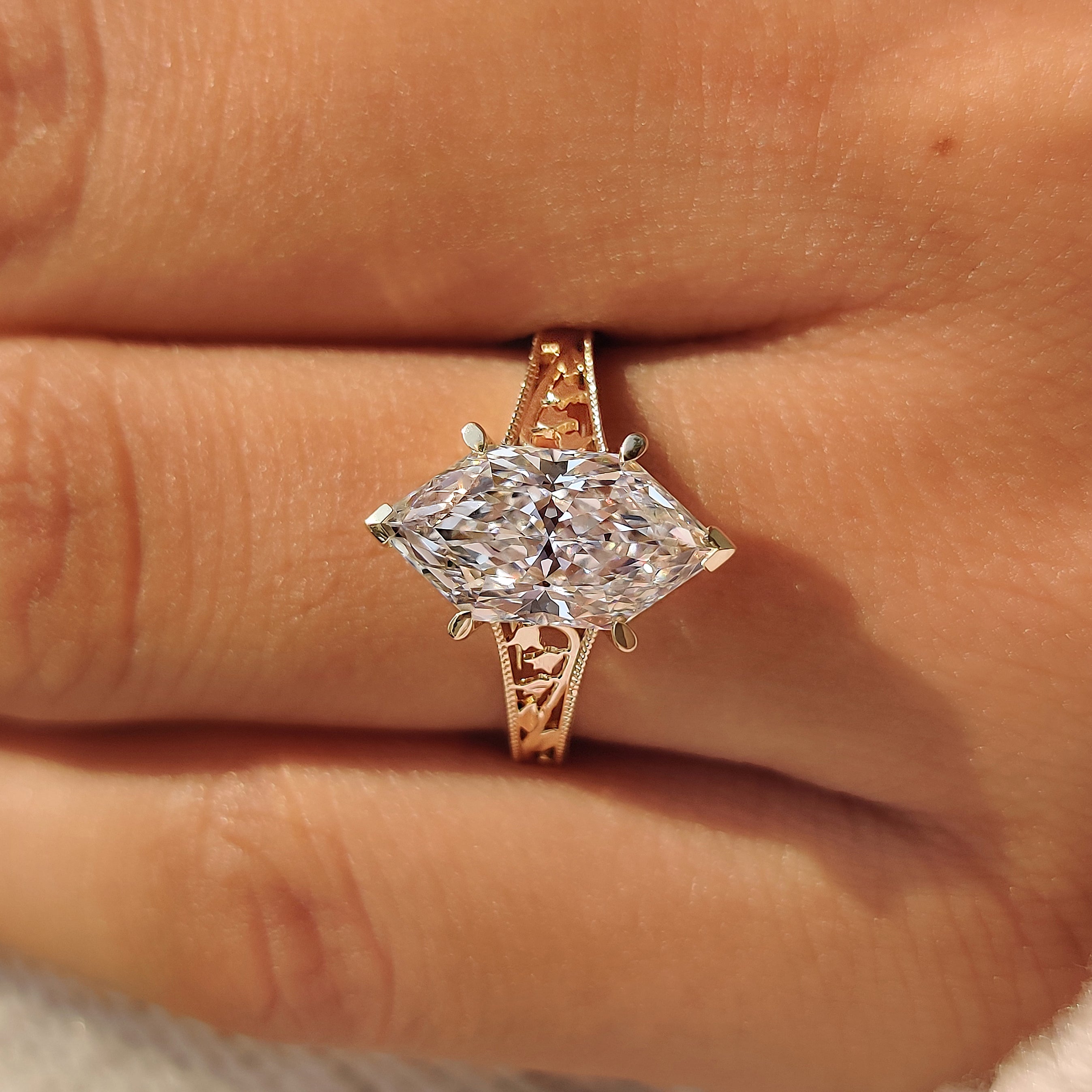 Dutch marquise solitaire ring with milgrain edging.
