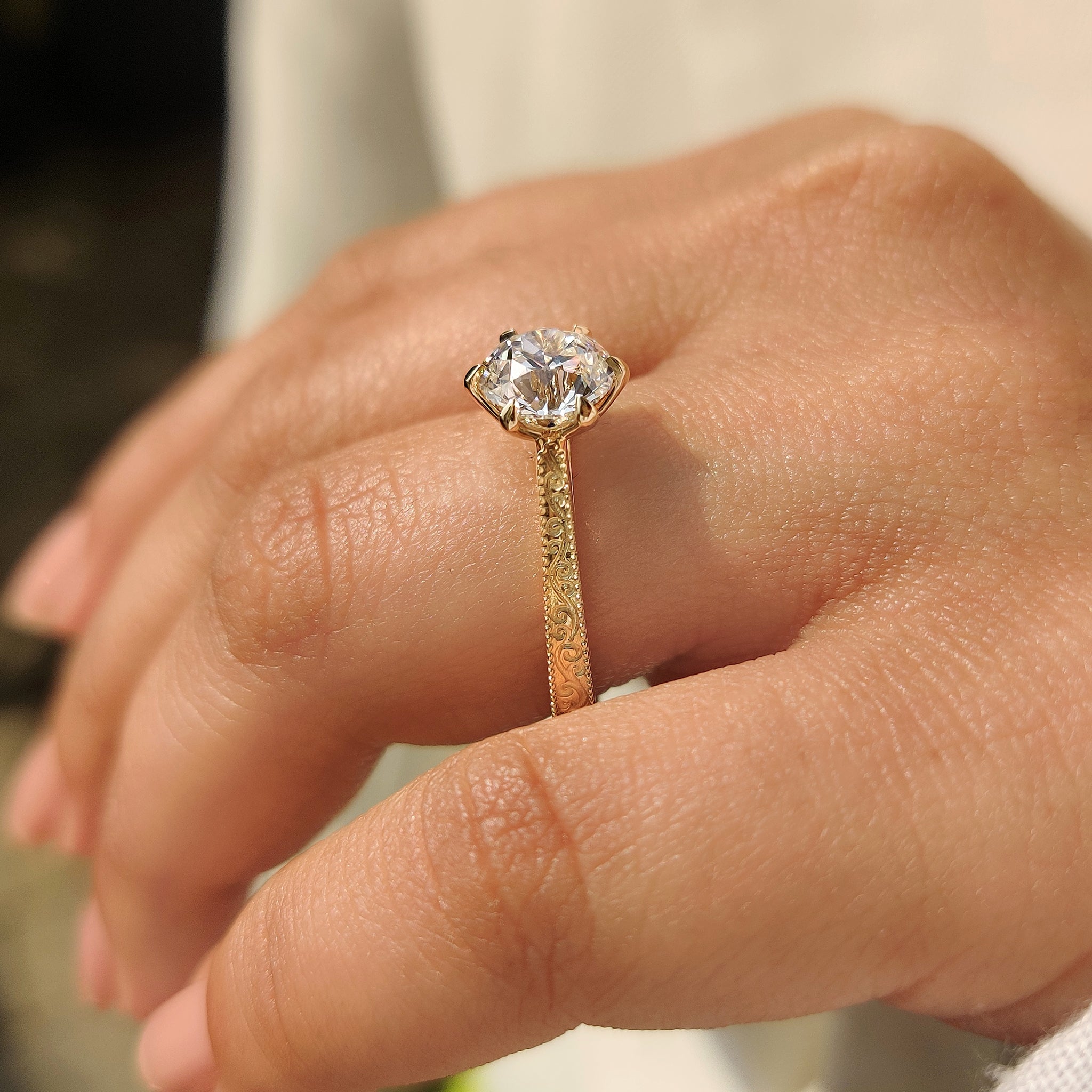 Old European cut round diamond ring with cathedral setting
