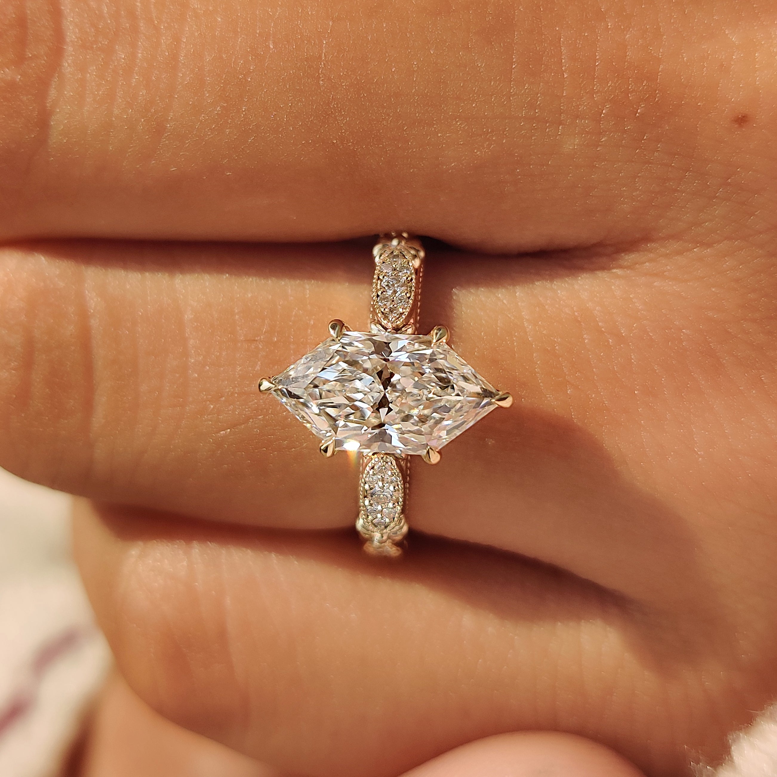 Dutch marquise diamond ring with milgrain detailing.
