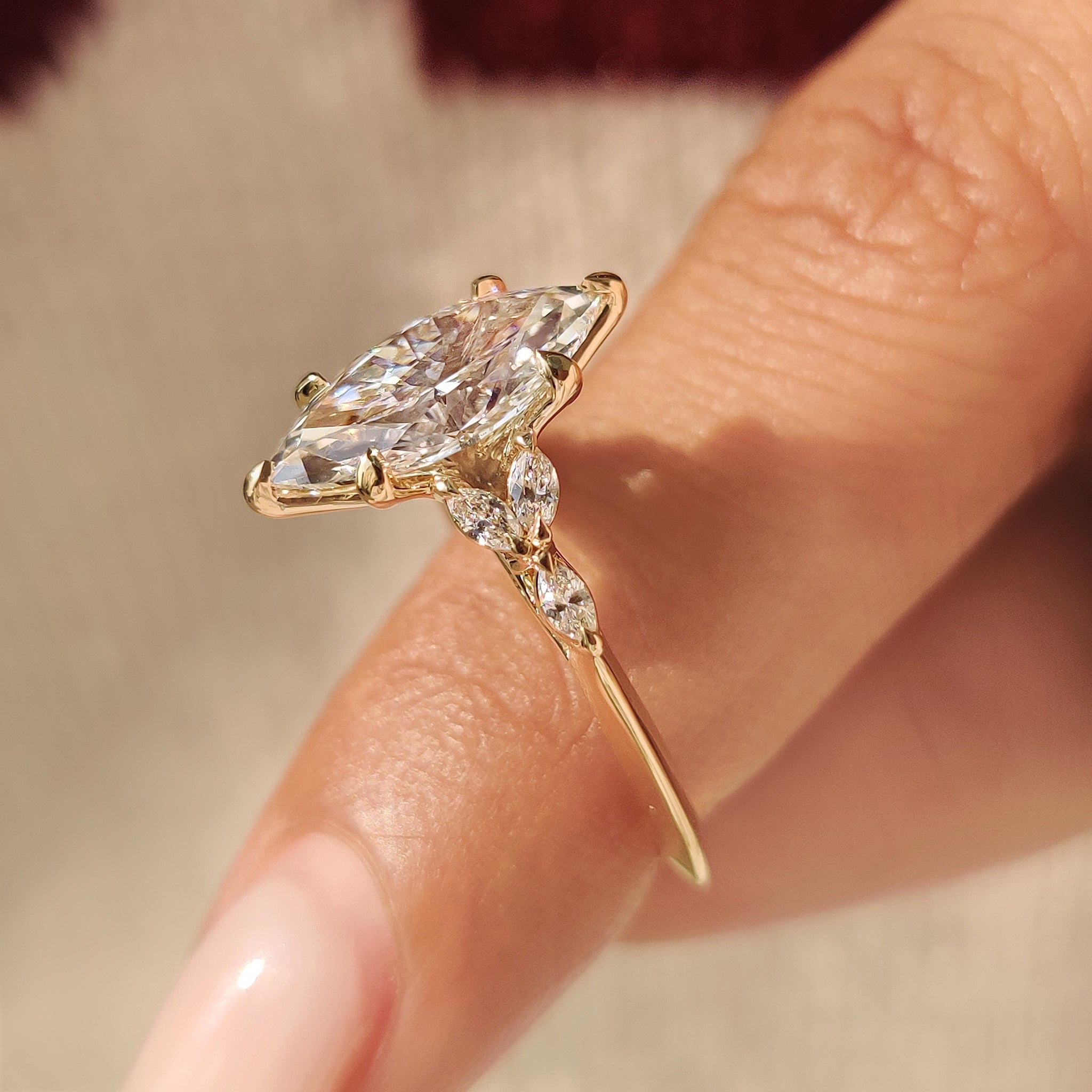 Marquise diamond ring with tulip setting and clean band
