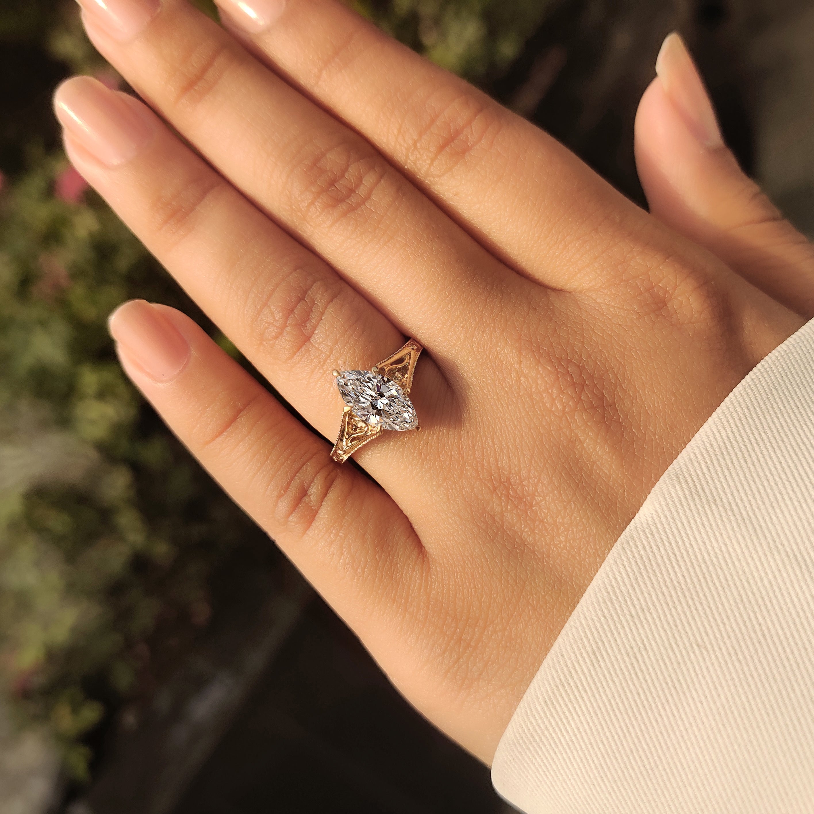 Vintage marquise diamond ring with solitaire and milgrain details.
