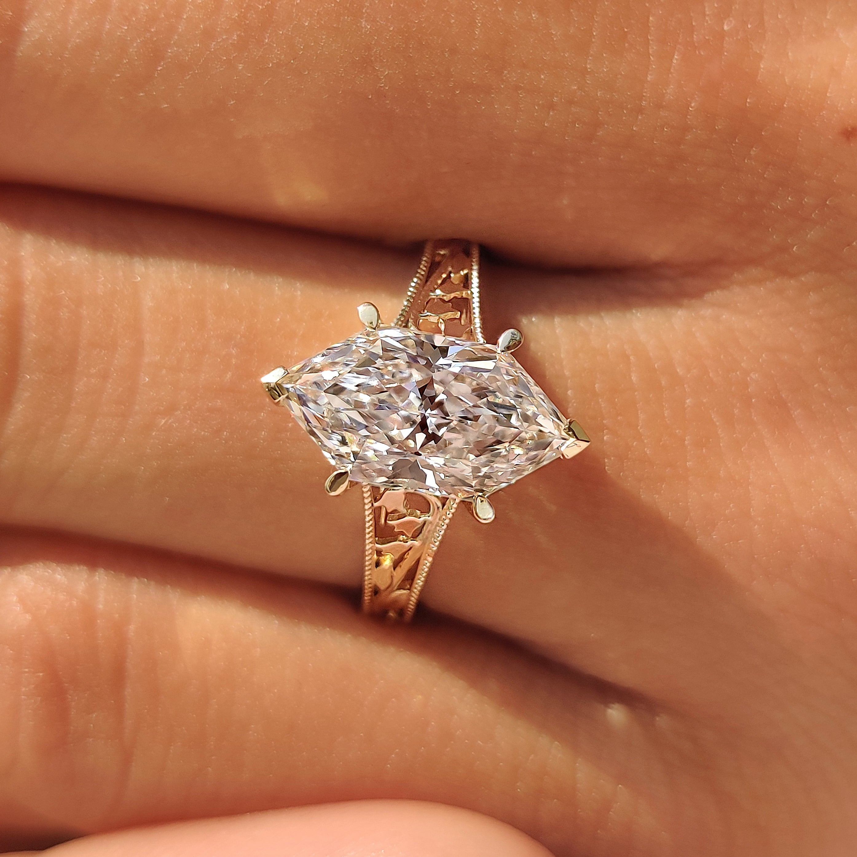 Four claw prong setting securing Dutch marquise diamond.
