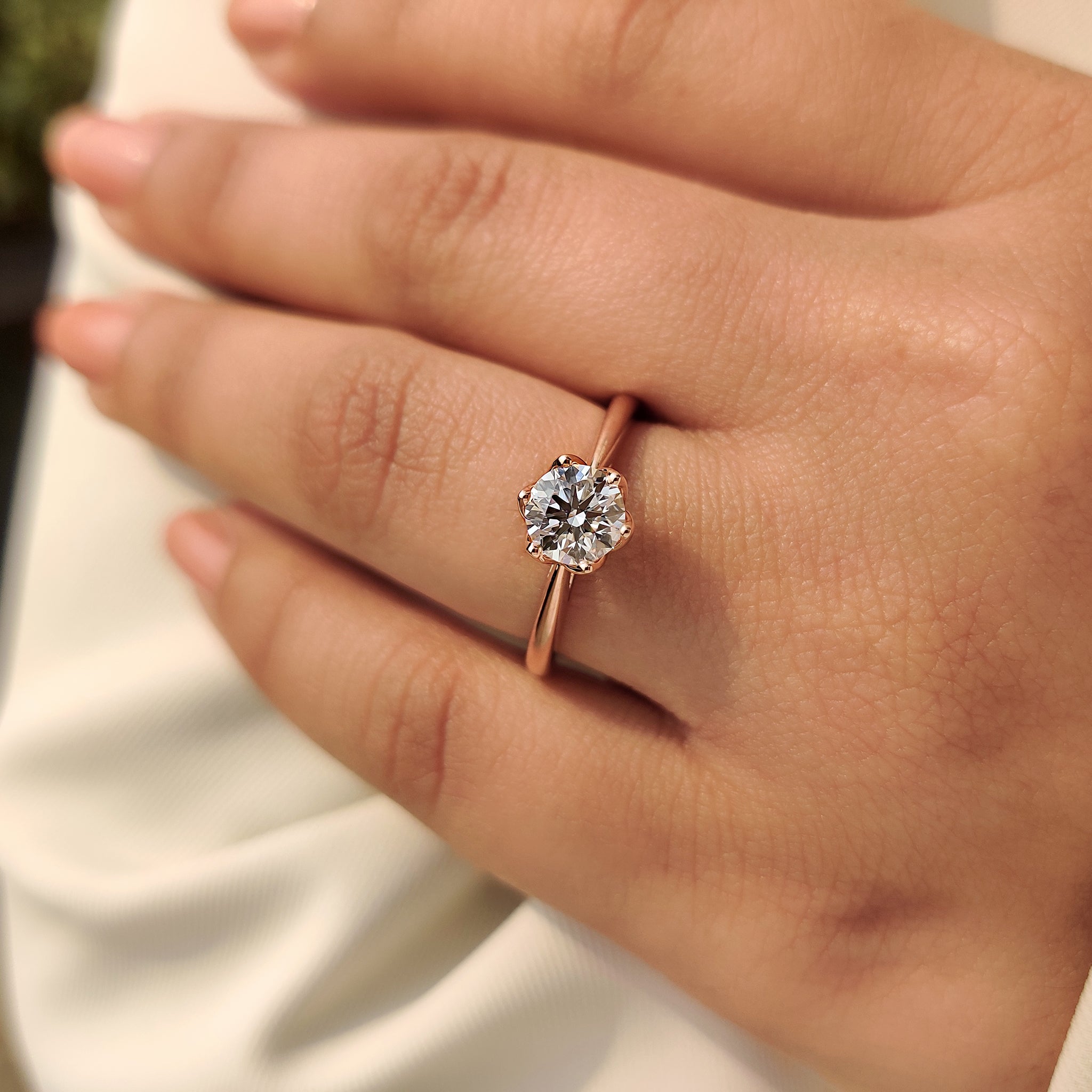 Round diamond ring with six prong setting style.
