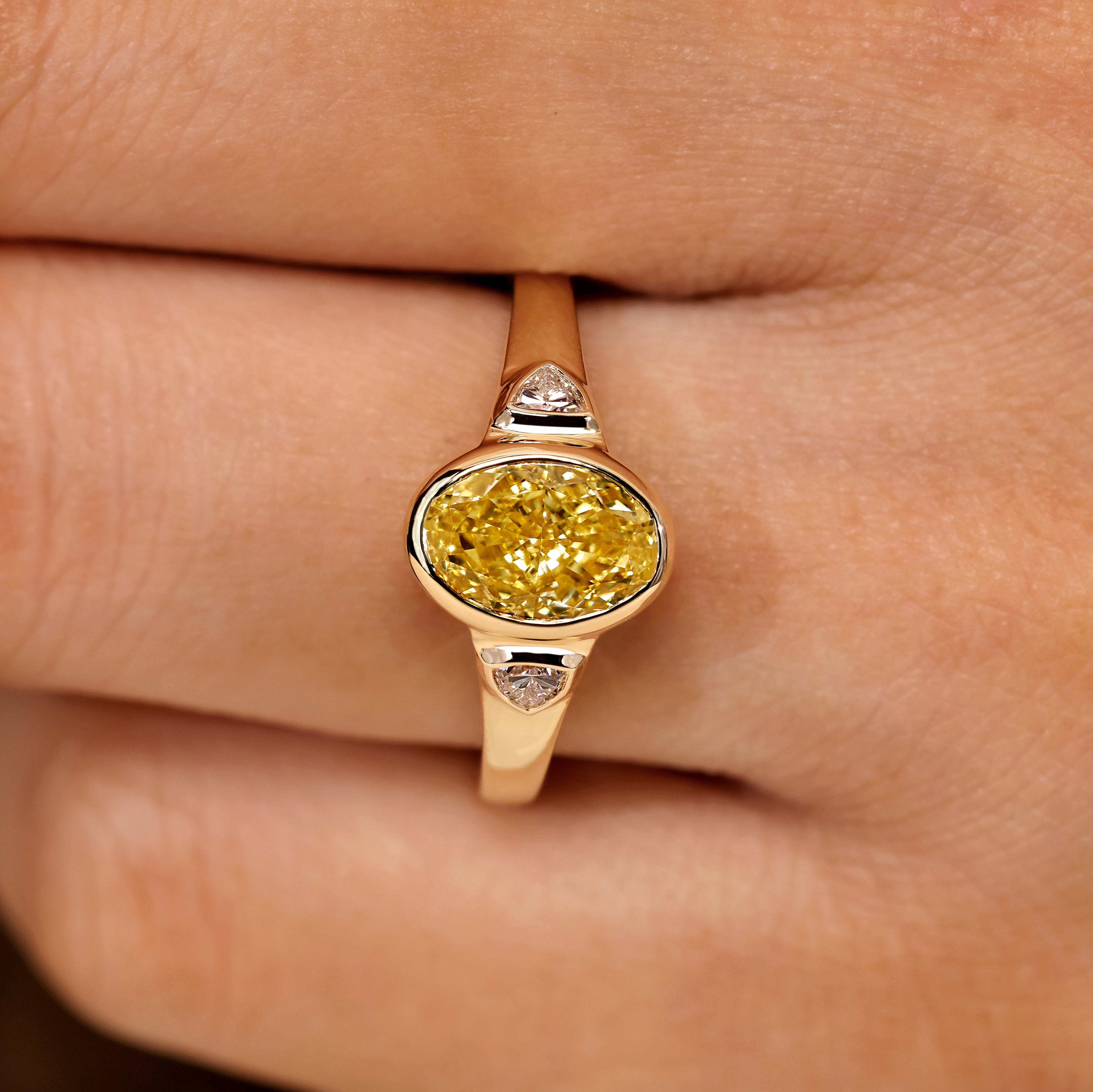 Three stone oval diamond ring with cathedral setting style
