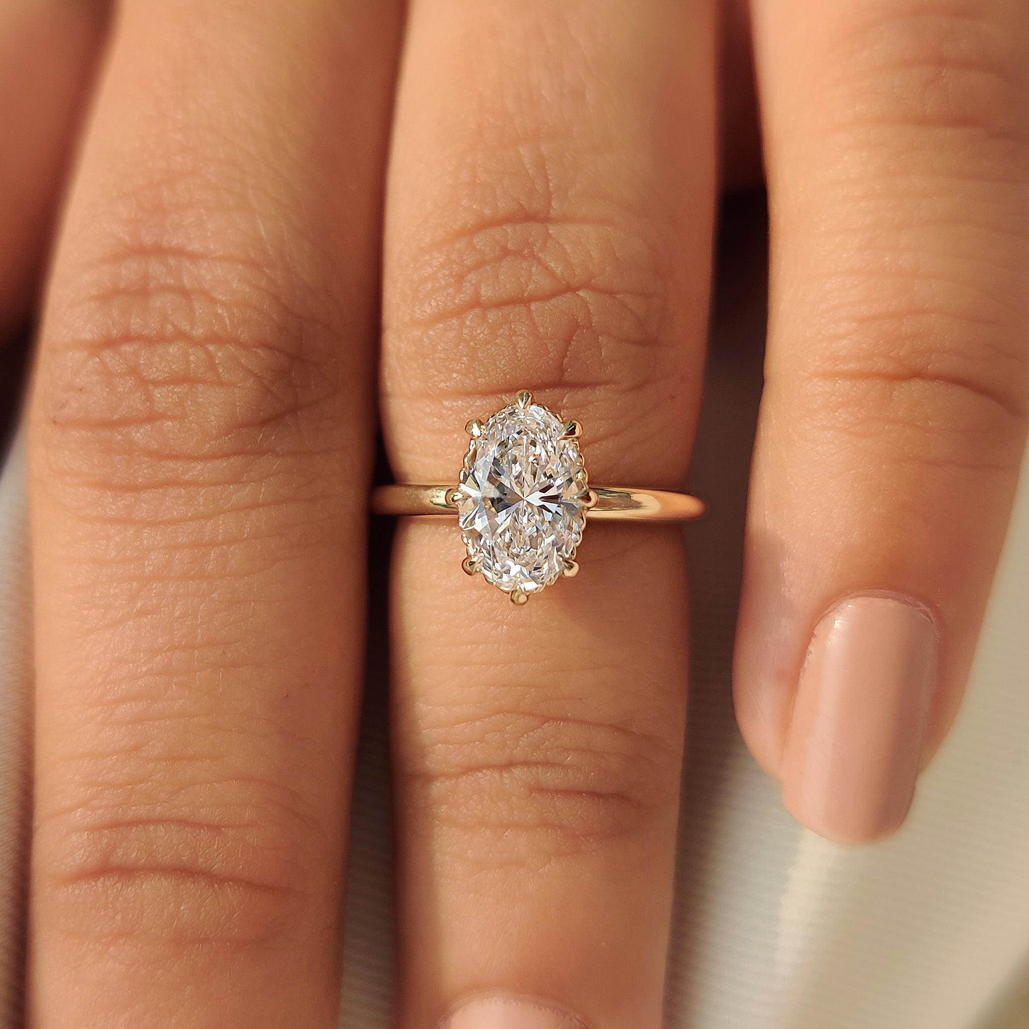 Handmade oval engagement ring with classic solitaire style

