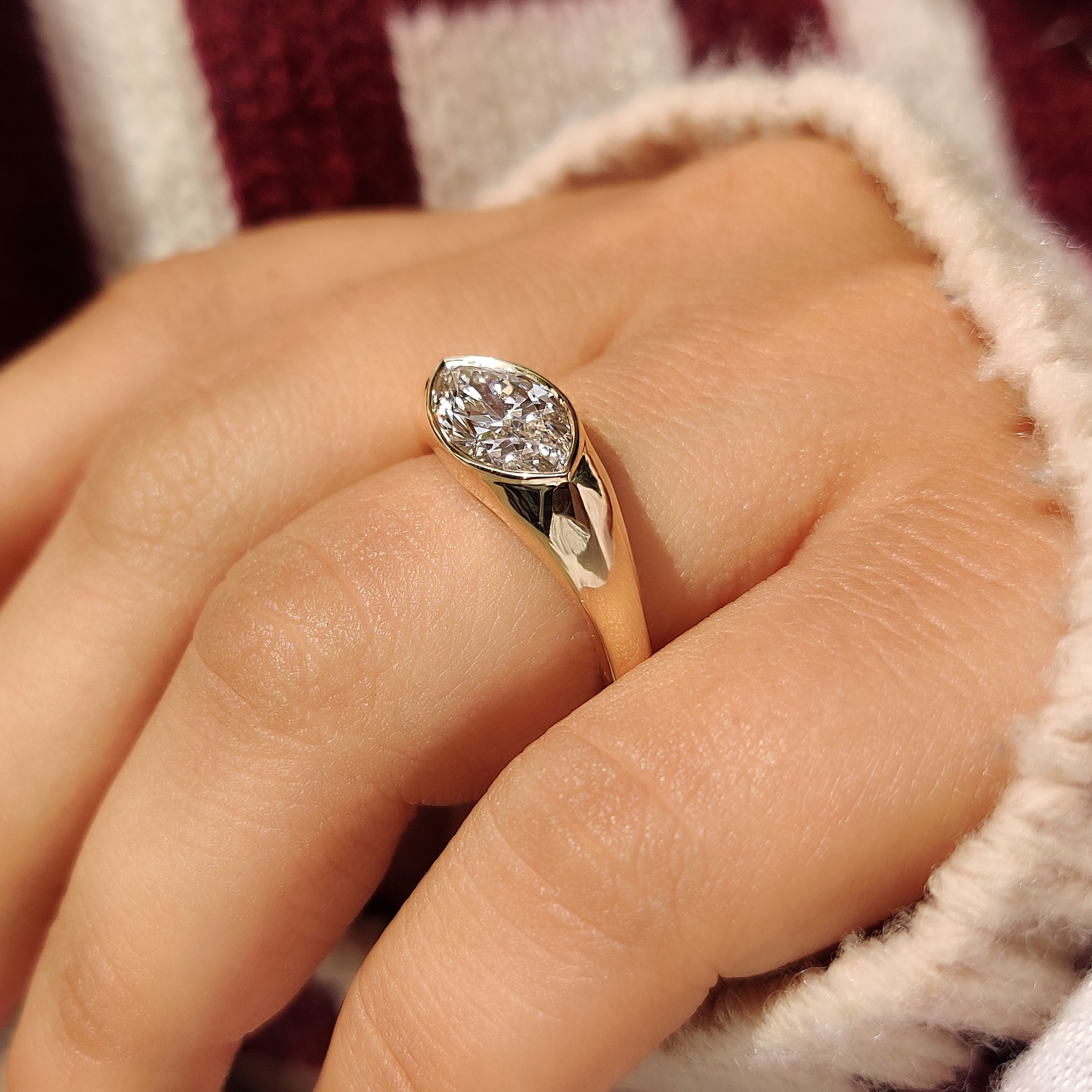 Solitaire marquise ring with chunky wide band
