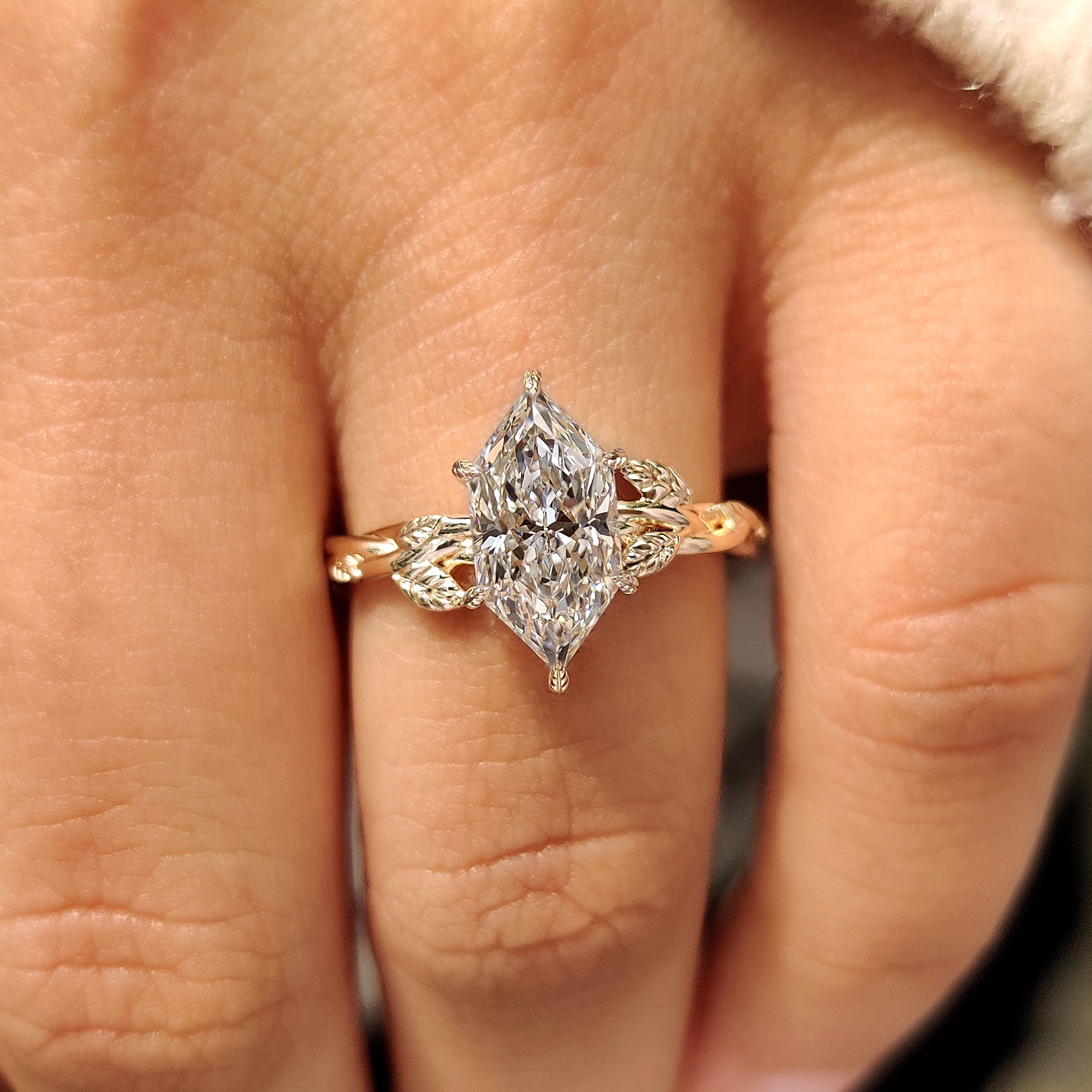 Dutch marquise diamond in six leaf style prong setting
