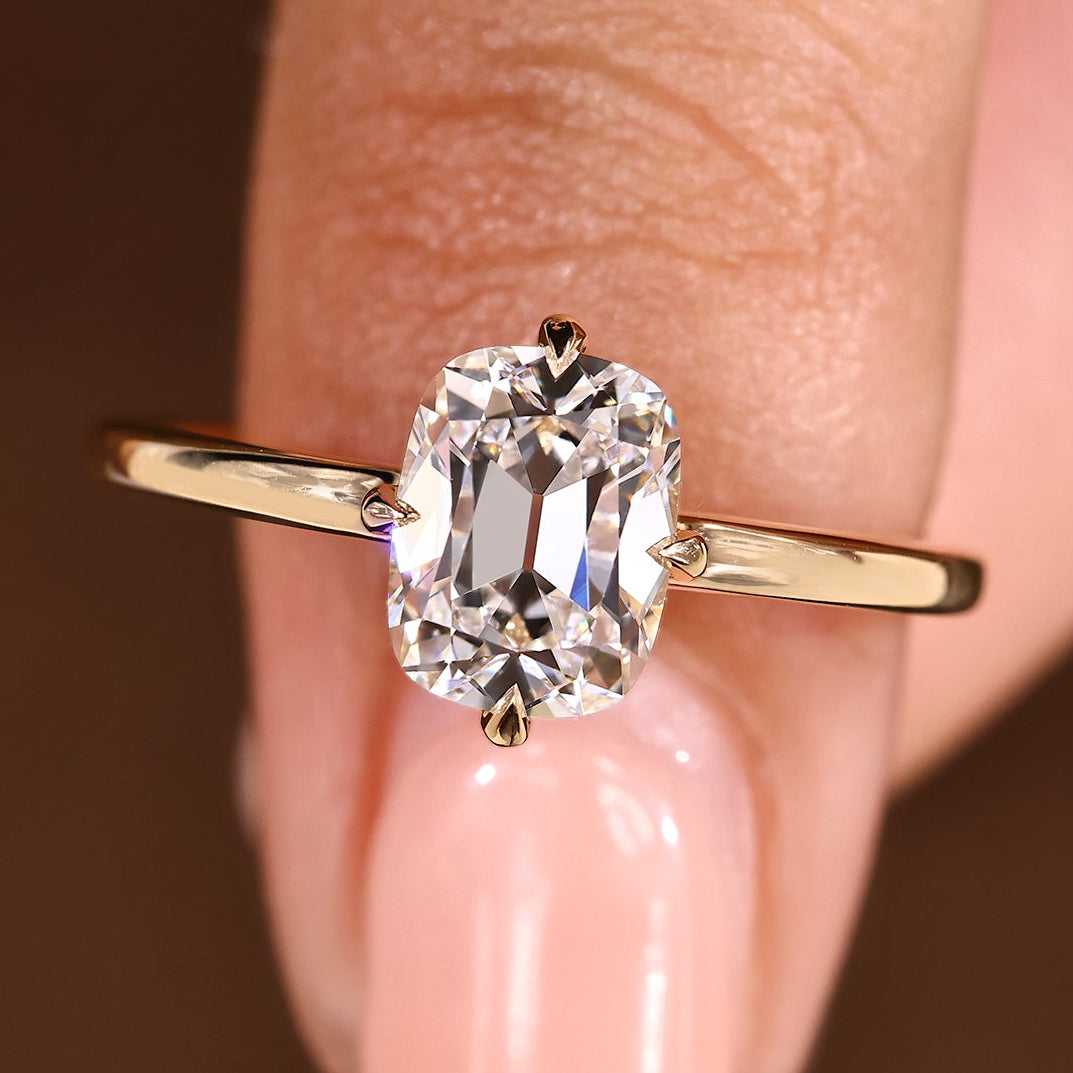 Cushion OMC cut diamond ring with hidden halo setting
