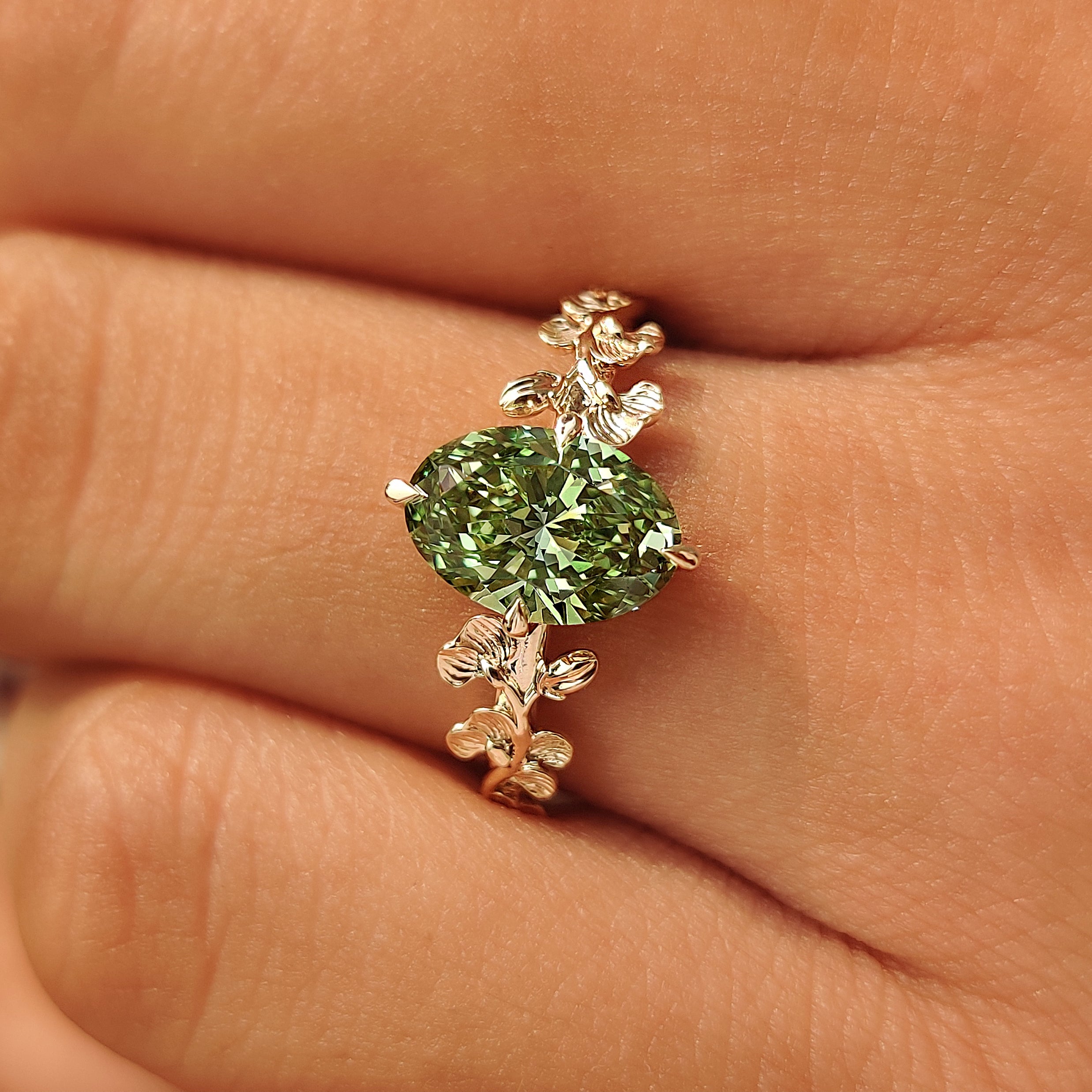 Nature inspired engagement ring with ginkgo leaf details.
