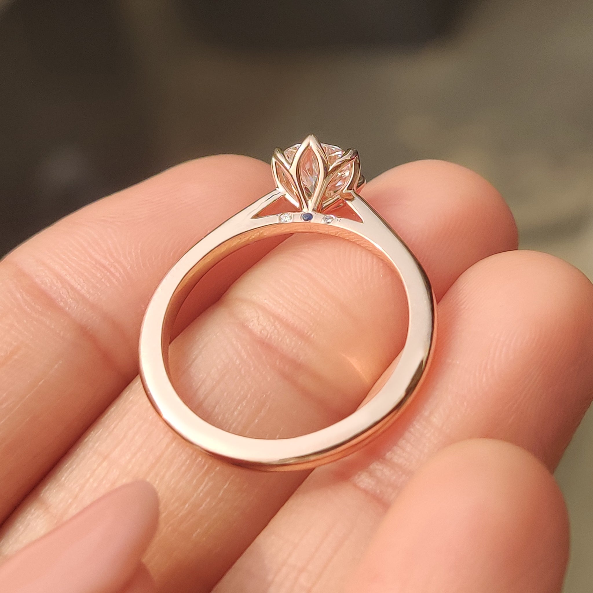 Lab grown diamond ring with sapphire accent.
